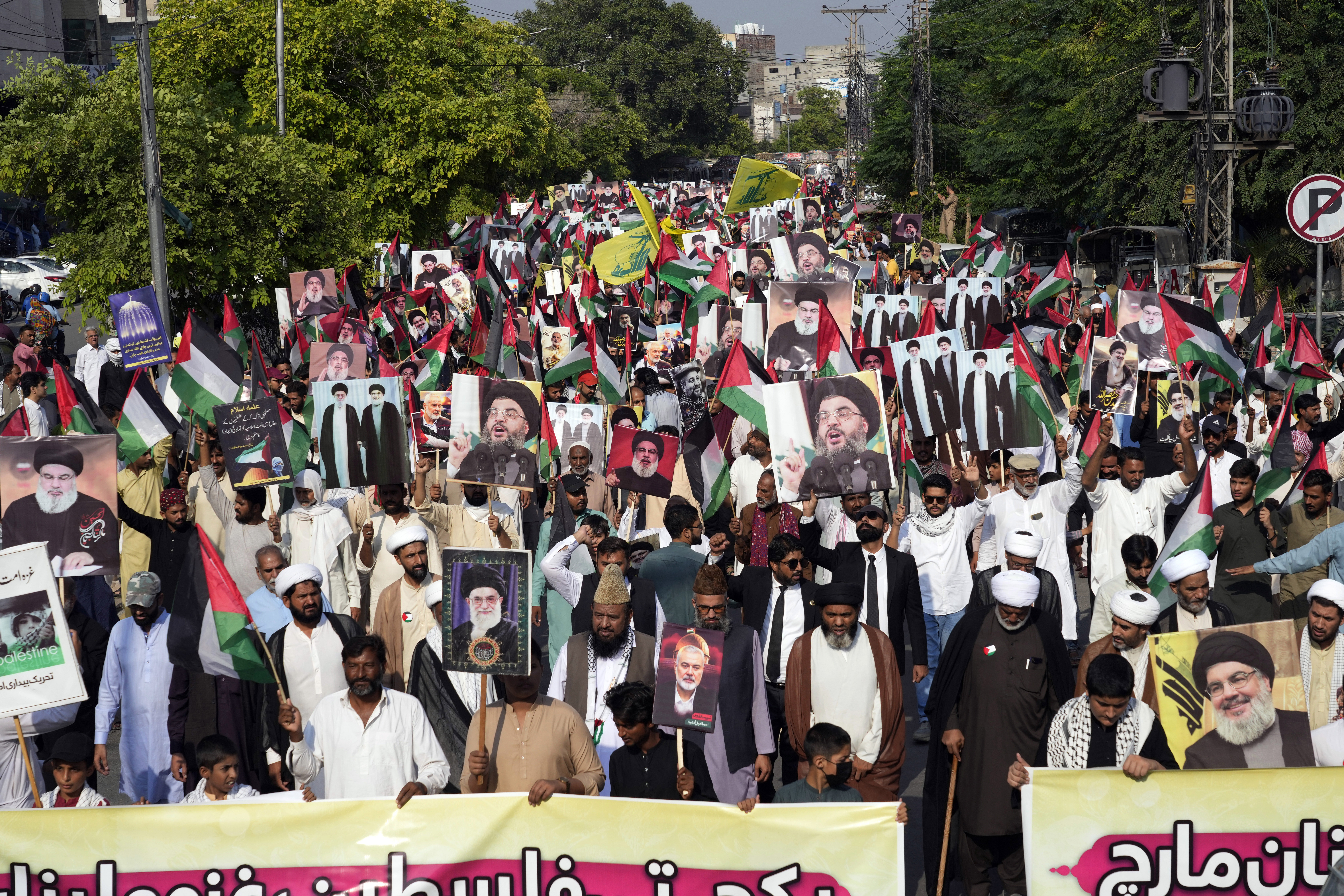 Supporters of the Tehreek-e-Bedari-e-Ummat-e-Mustafa take part in a rally against Israeli airstrikes and to show solidarity with people in Gaza and Lebanon, in Lahore, Pakistan, Monday, Oct. 7