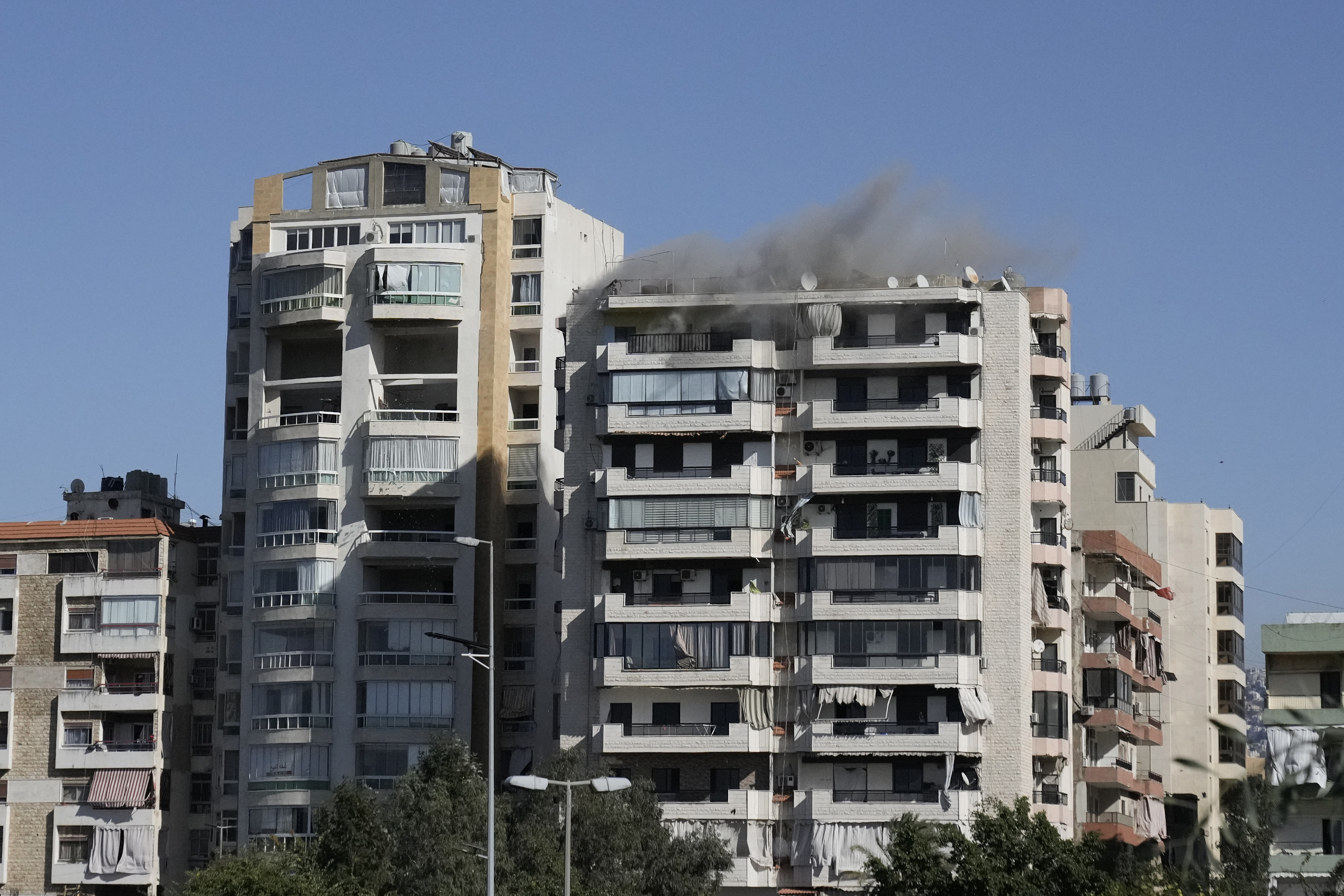 Images capture exact moments an Israeli missile strikes building in Beirut