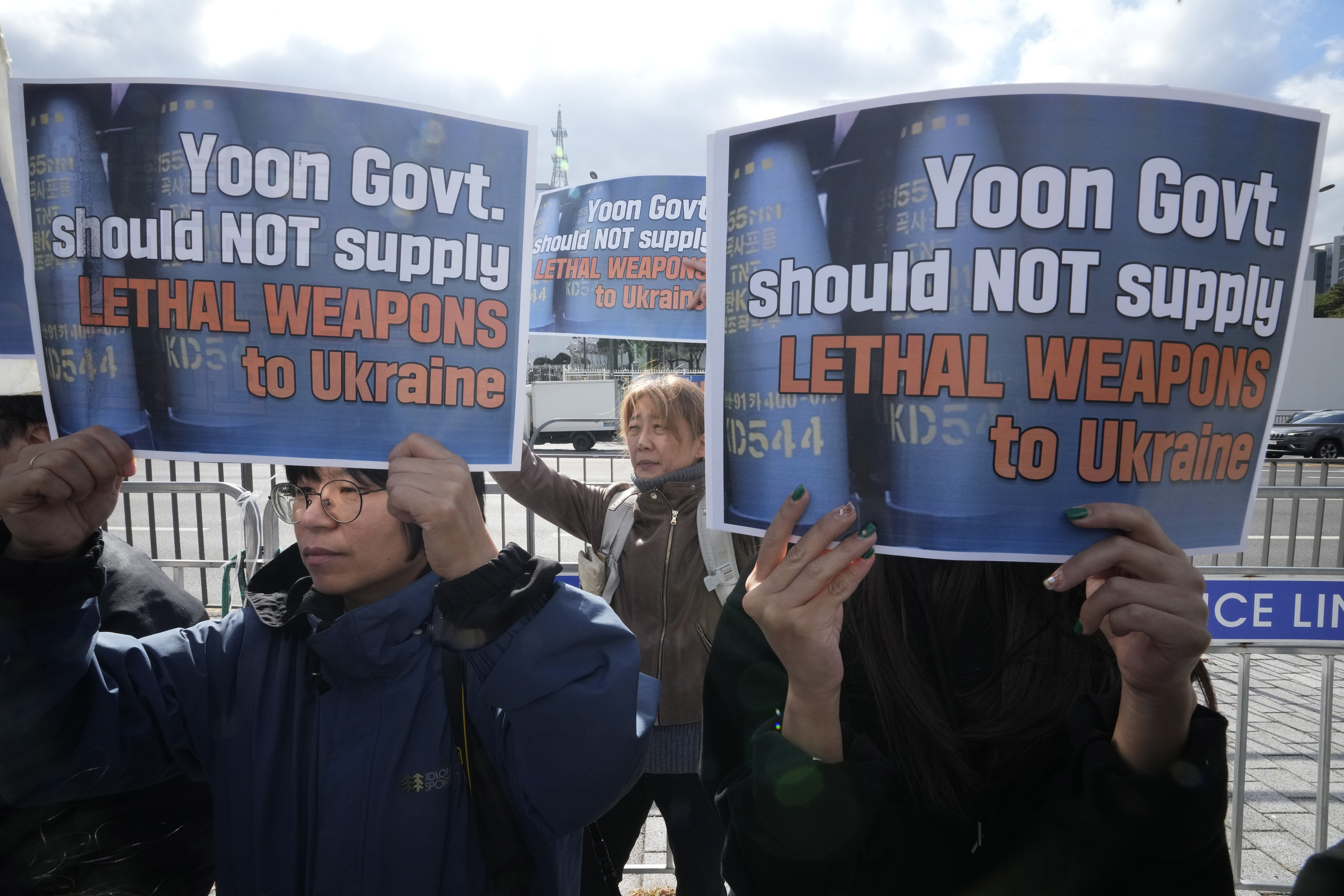 South Korean protesters stage a rally against their government's plans to supply lethal weapons to Ukraine