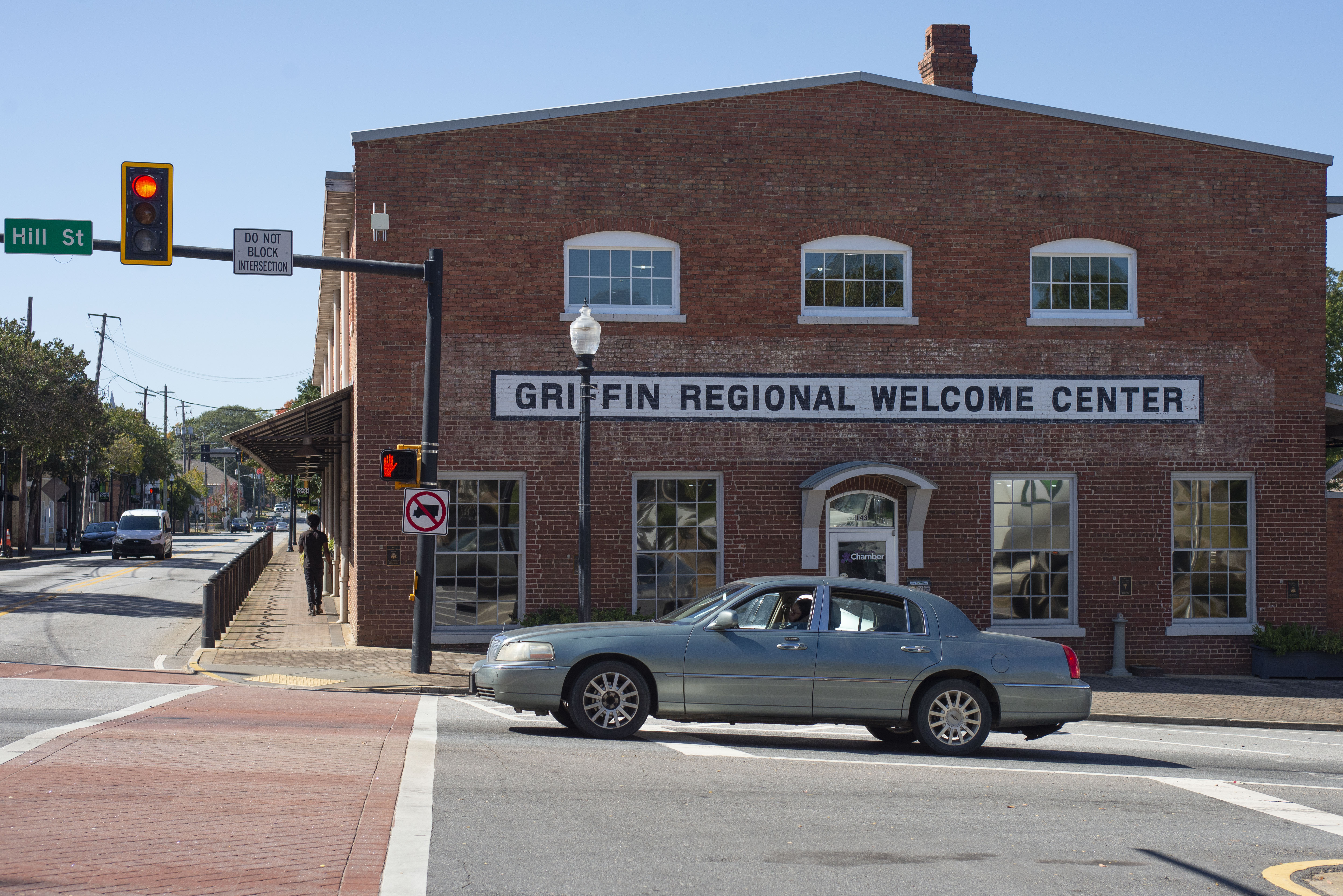 A man walks near a welcome center in Spalding County, Georgia [Joseph Stepansky/Al Jazeera]