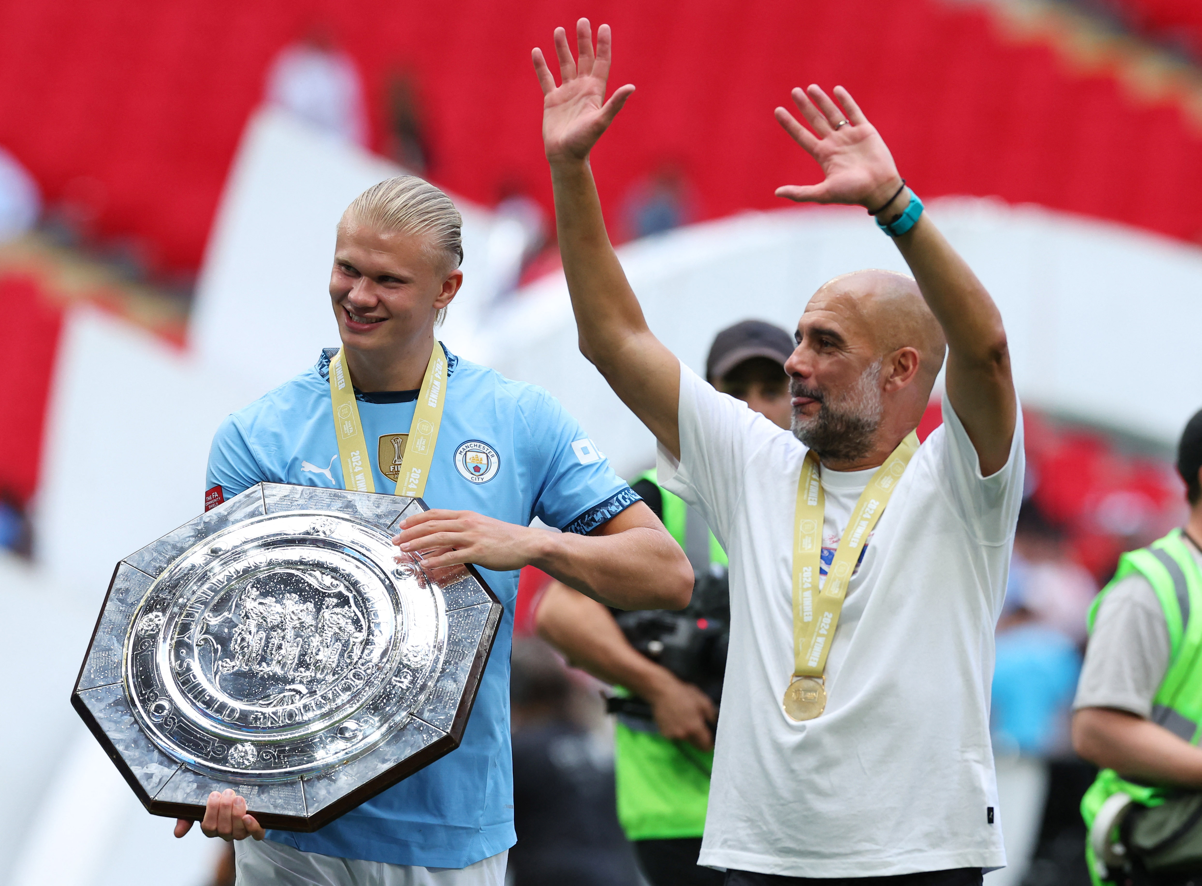 Erling Haaland, left, has been the figurehead of Manchester City's latest evolution [Toby Melville/Reuters]