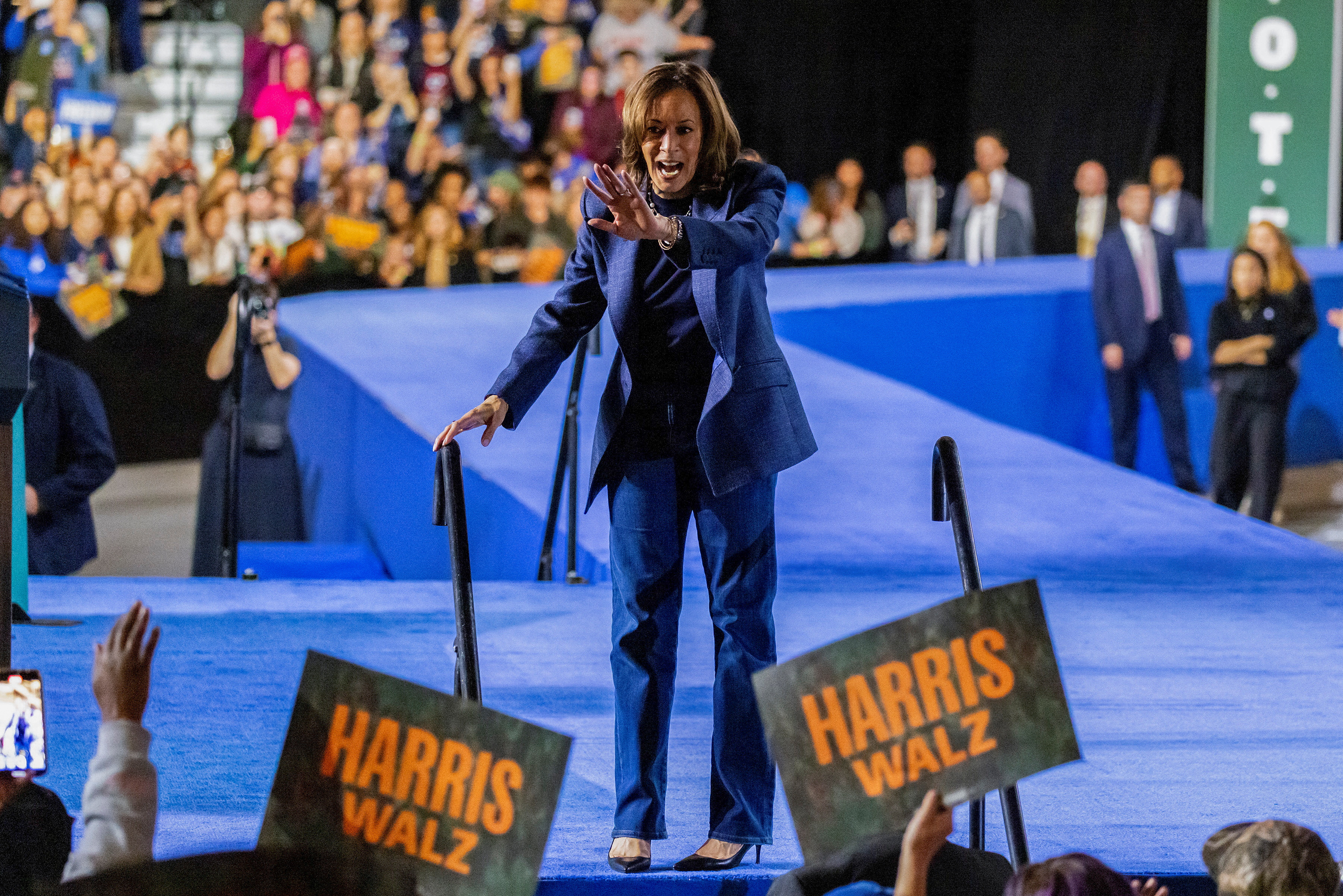 Kamala Harris stands on stage at a campaign rally in Michigan