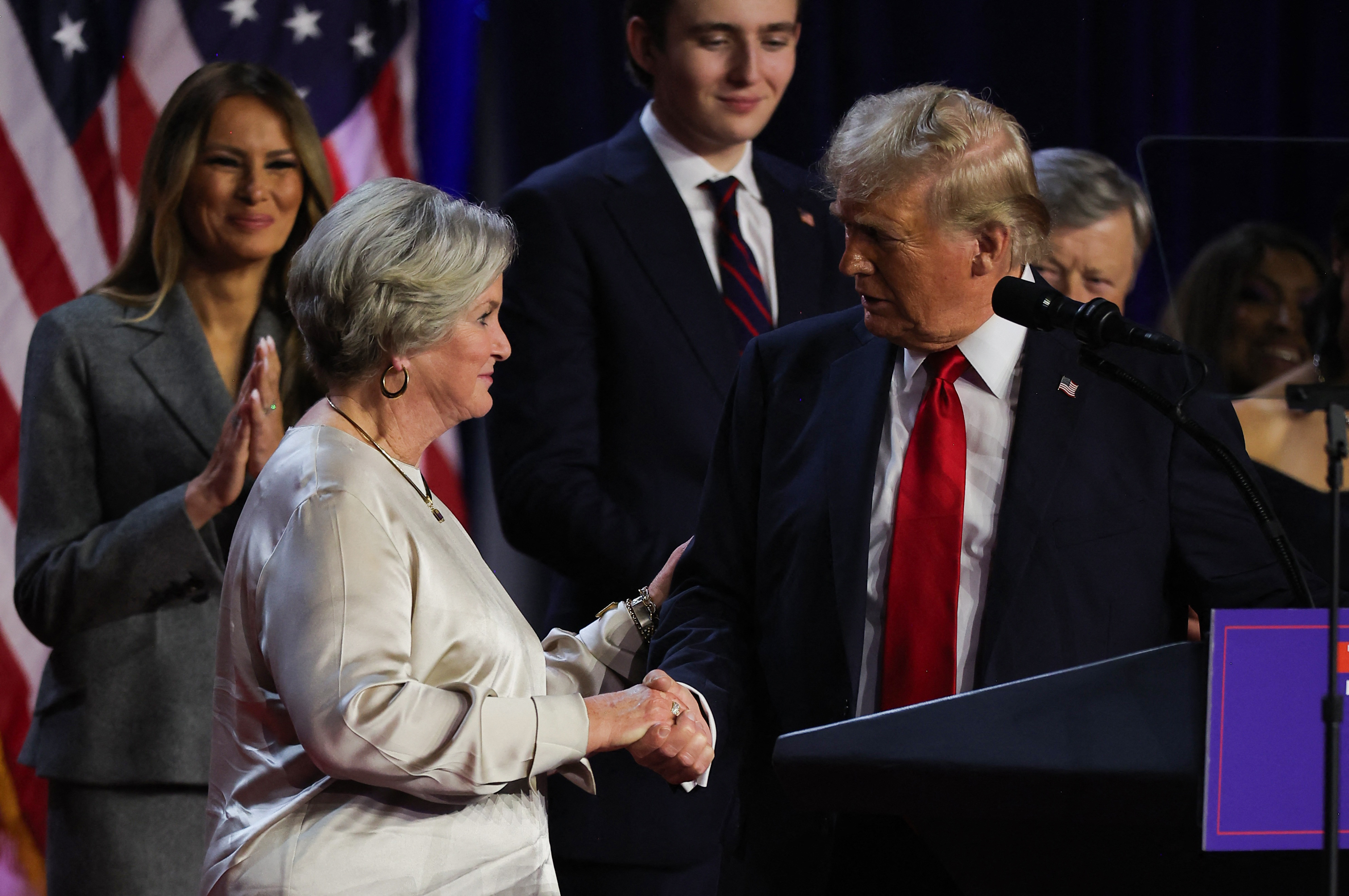 Trump shakes hands with campaign manager Susie Wiles