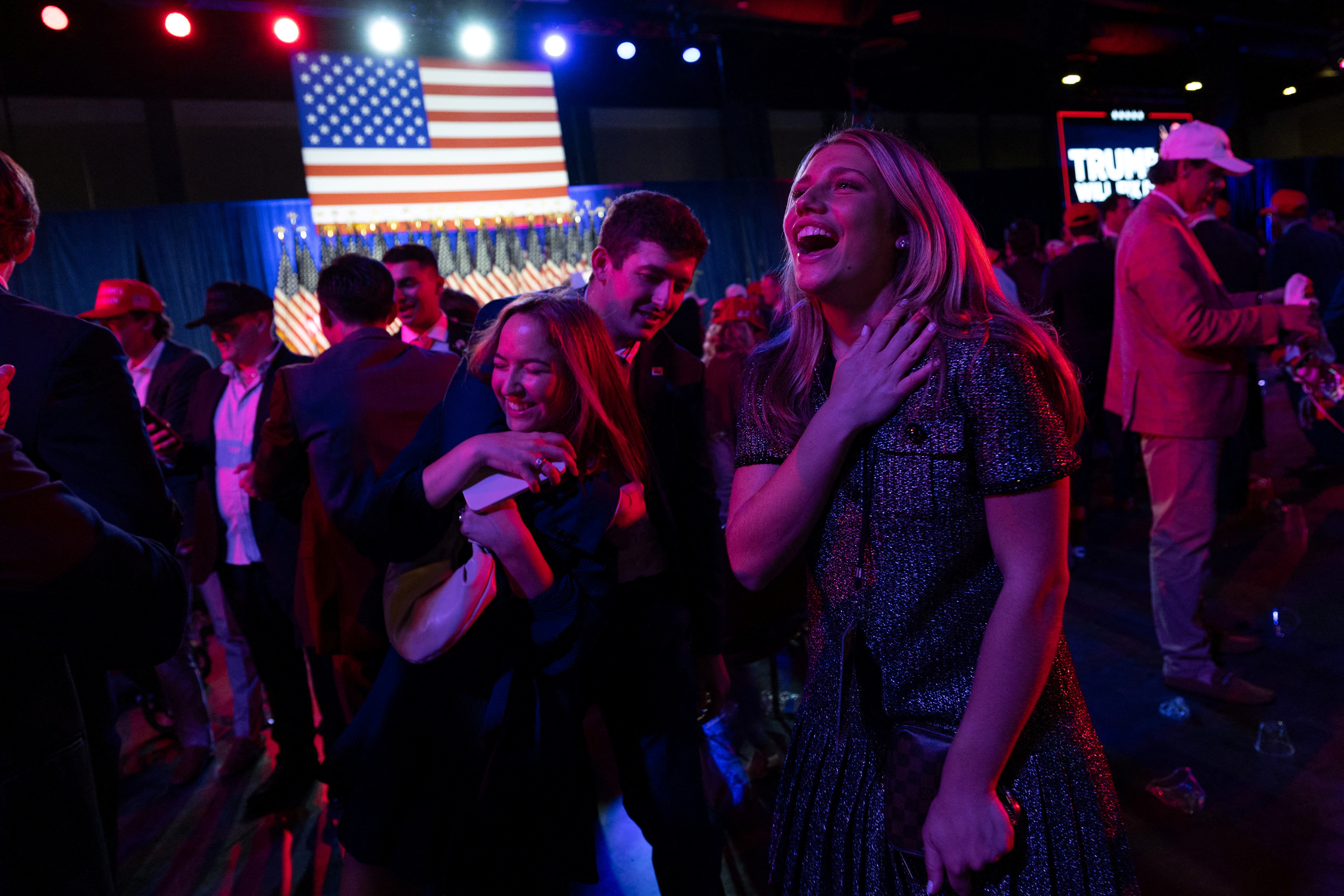 A supporter of Republican presidential nominee and former U.S. President Donald Trump reacts following early results from the 2024 U.S. presidential election in Palm Beach County Convention Center, in West Palm Beach, Florida, U.S., November 6