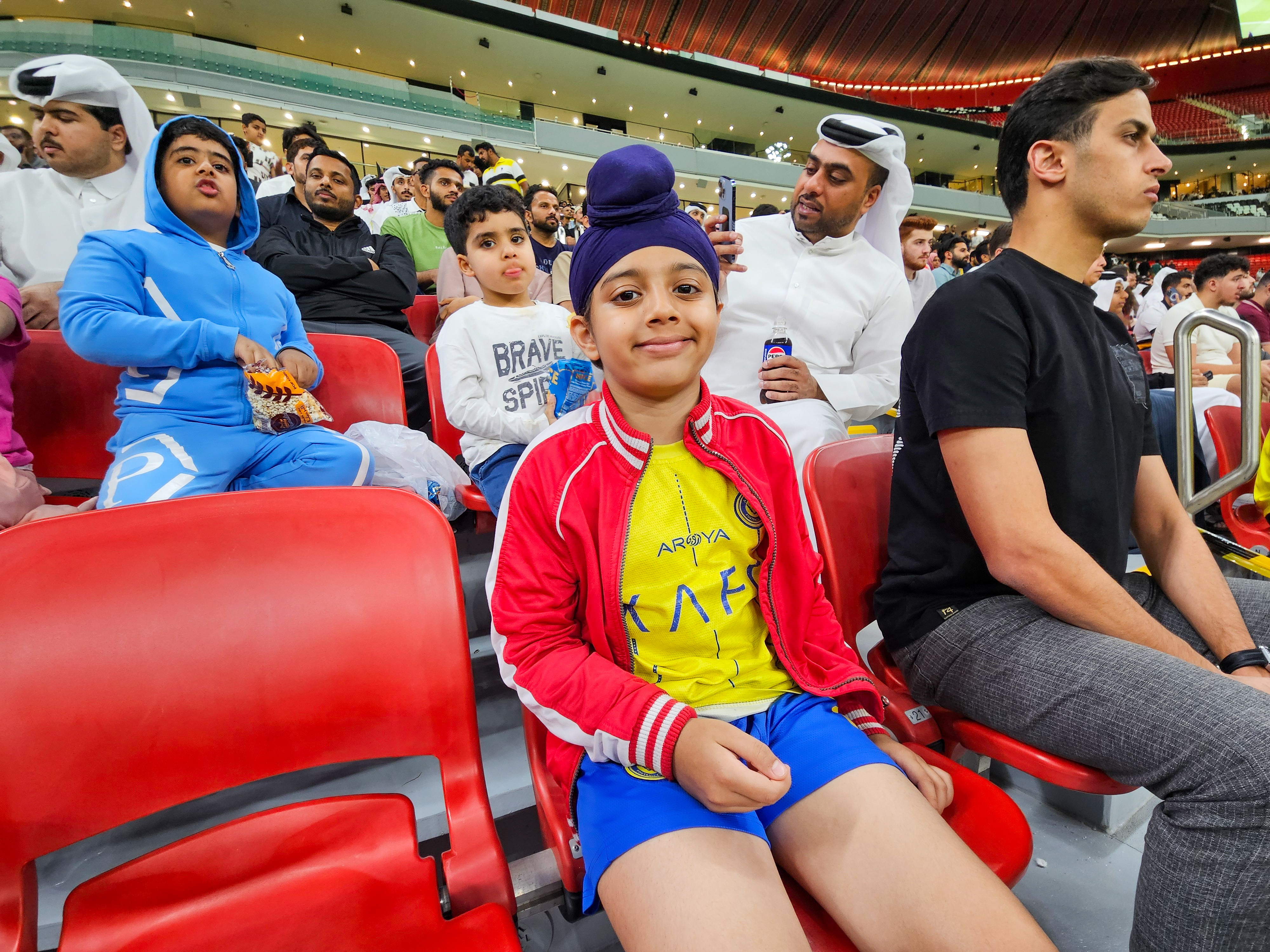 Football fan Arshveer Singh at the AFC Champions League Elite Group B match between Al Gharafa SC of Qatar and Al Nassr FC at the Al Bayt Stadium in Al Khor, Qatar [Hafsa Adil/Al Jazeera]