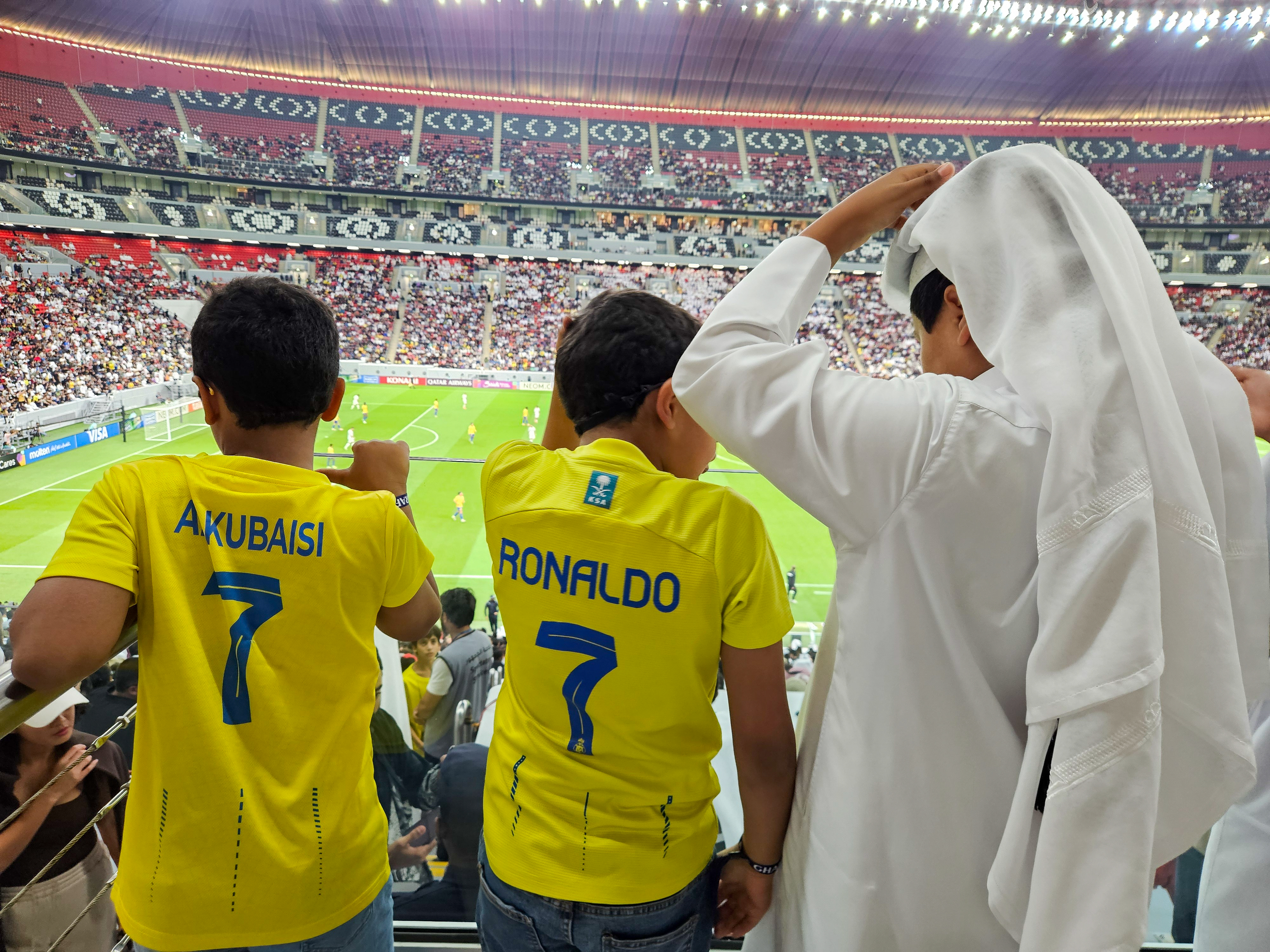 Football fans at the AFC Champions League Elite Group B match between Al Gharafa SC of Qatar and Al Nassr FC at the Al Bayt Stadium in Al Khor, Qatar [Hafsa Adil/Al Jazeera]