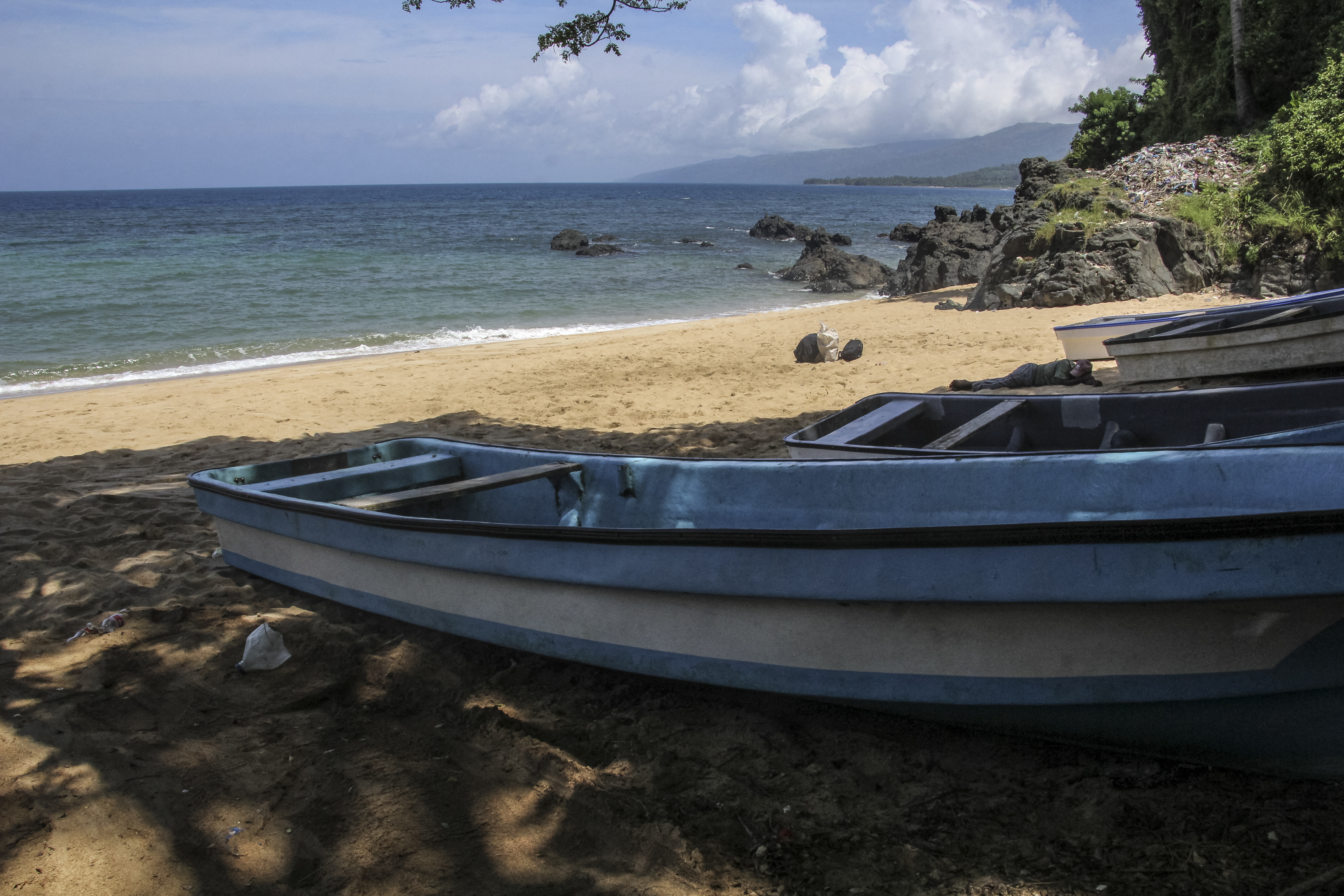 Boats sits on Plage de Moya south of city of Mutsamudu, the capital of Anjouan in the Comoros Archipelago