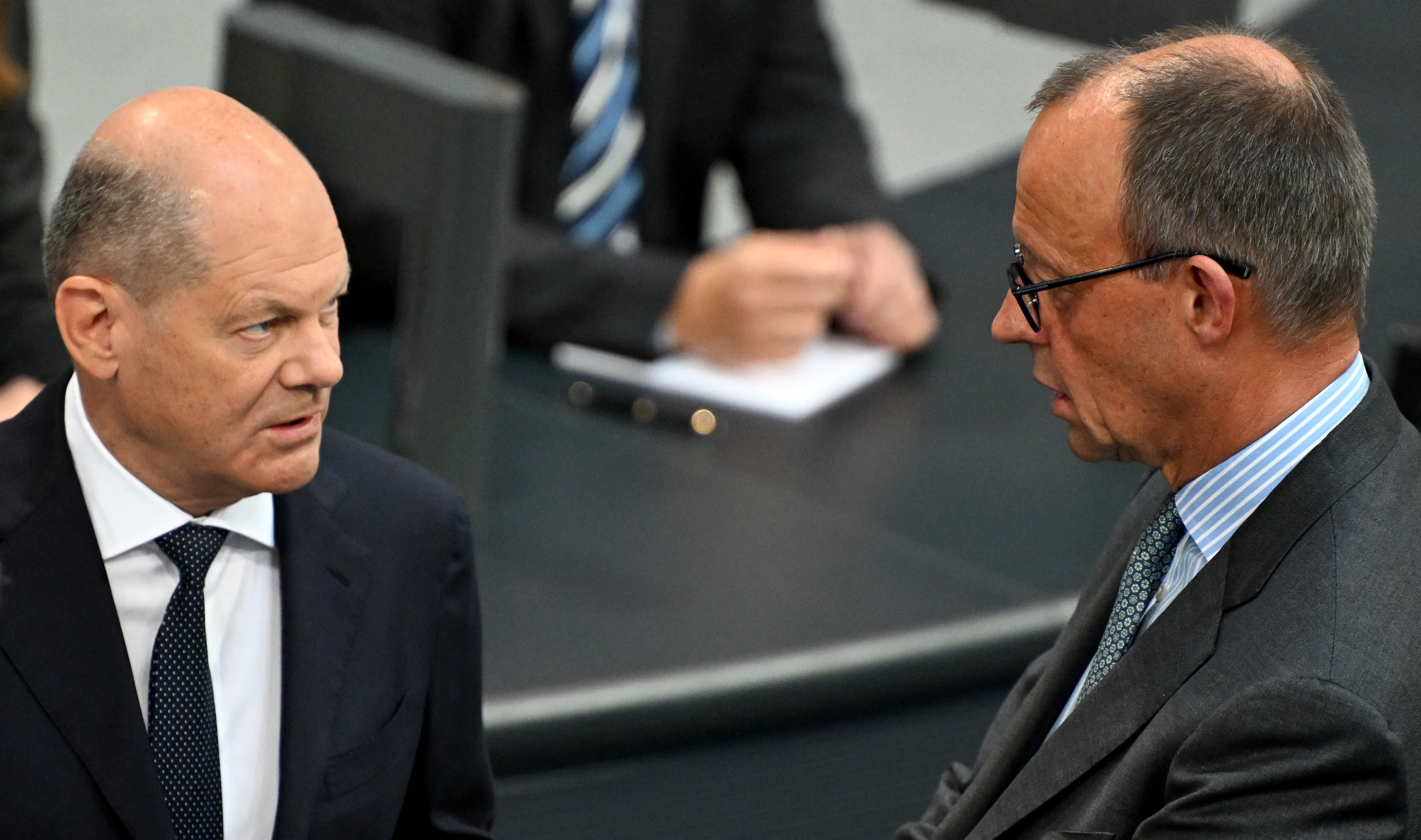 German Chancellor Olaf Scholz and opposition leader Friedrich Merz