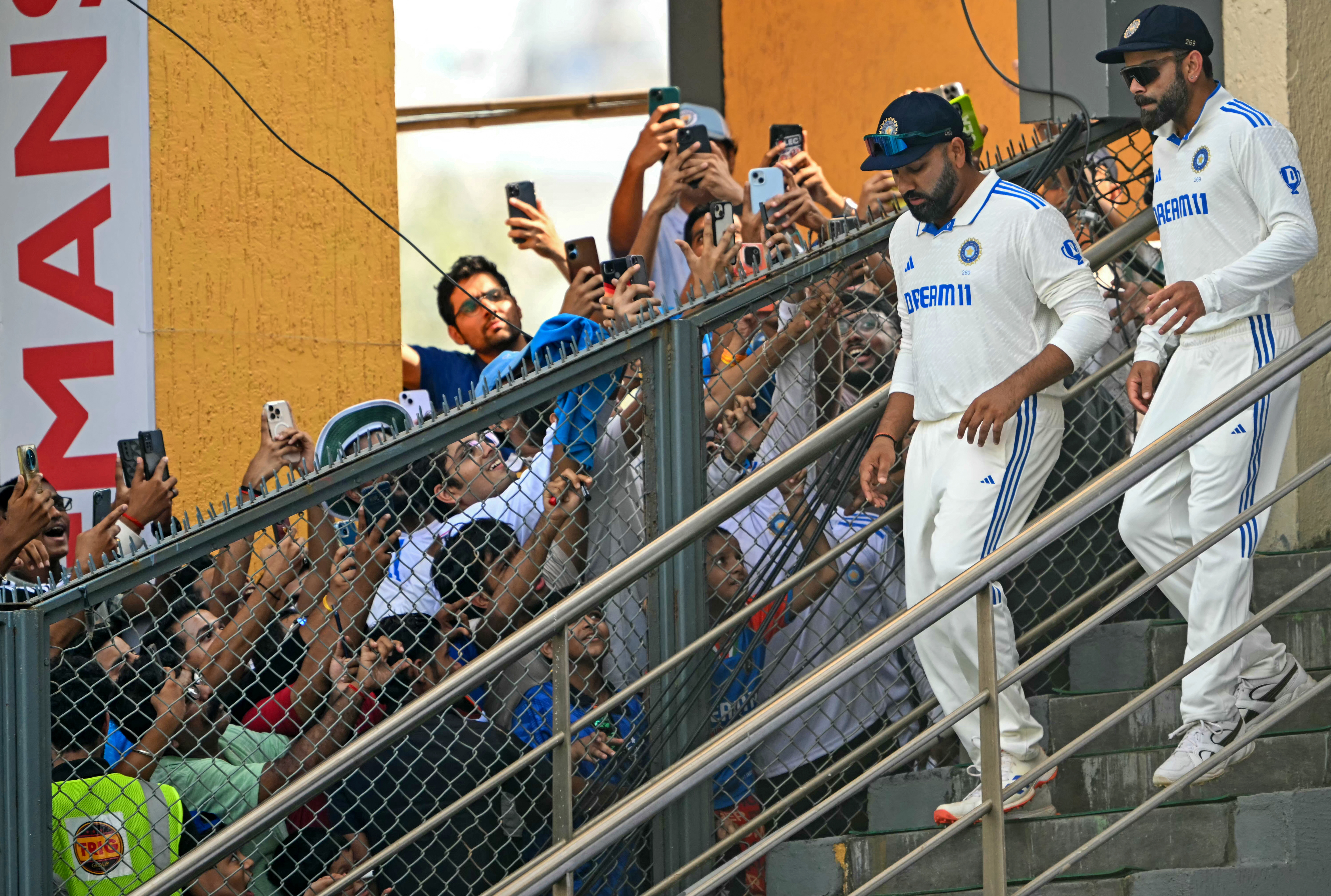 India's Virat Kohli (R) and captain Rohit Sharma arrive for the second innings on the second day of the third Test cricket match between India and New Zealand at the Wankhede stadium in Mumbai on November 2, 2024. (Photo by INDRANIL MUKHERJEE / AFP) / -- IMAGE RESTRICTED TO EDITORIAL USE - STRICTLY NO COMMERCIAL USE --
