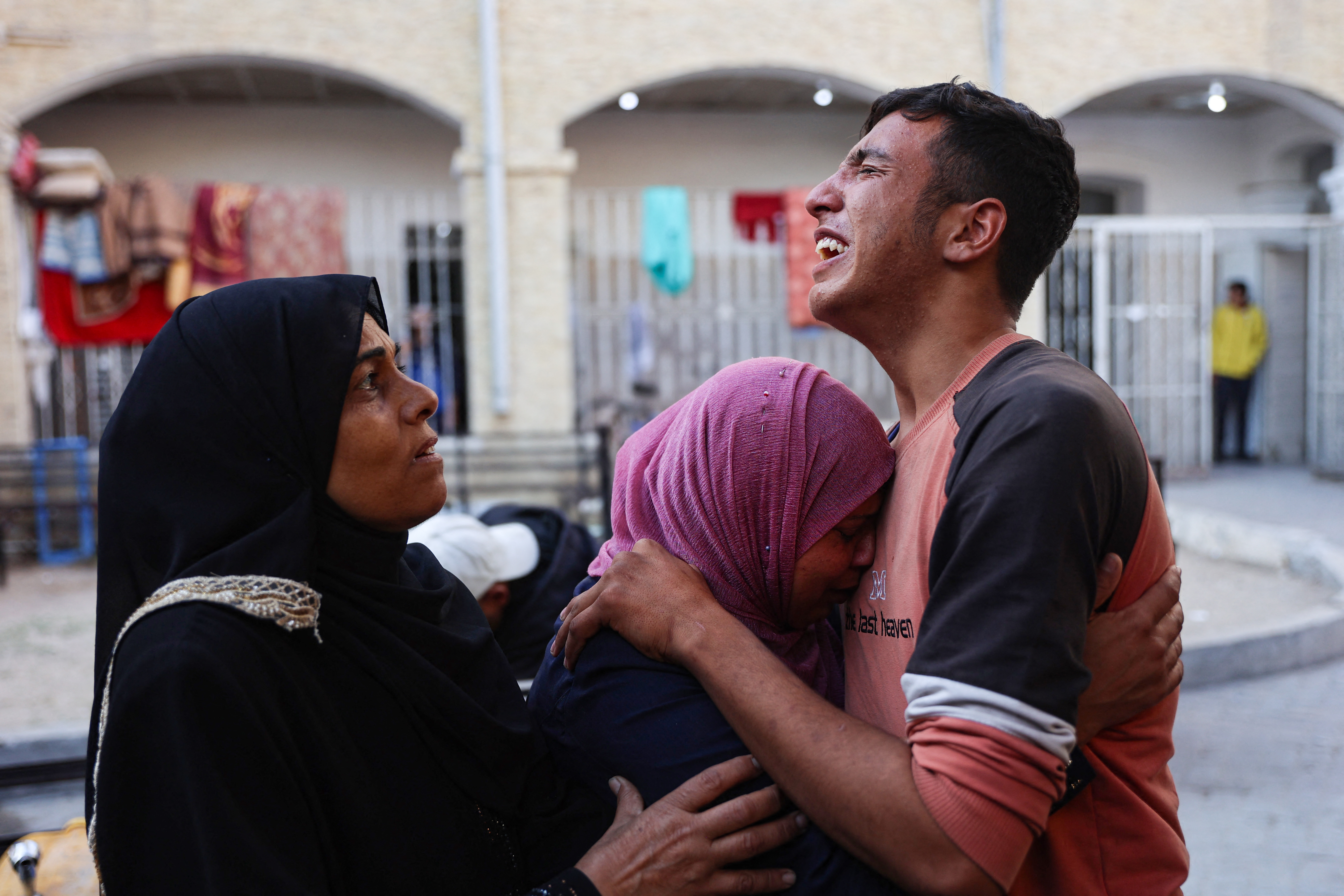Relatives mourn the death of Atef Al-Atout, a Palestinian man who his family said was shot dead as he fled Beit Lahia