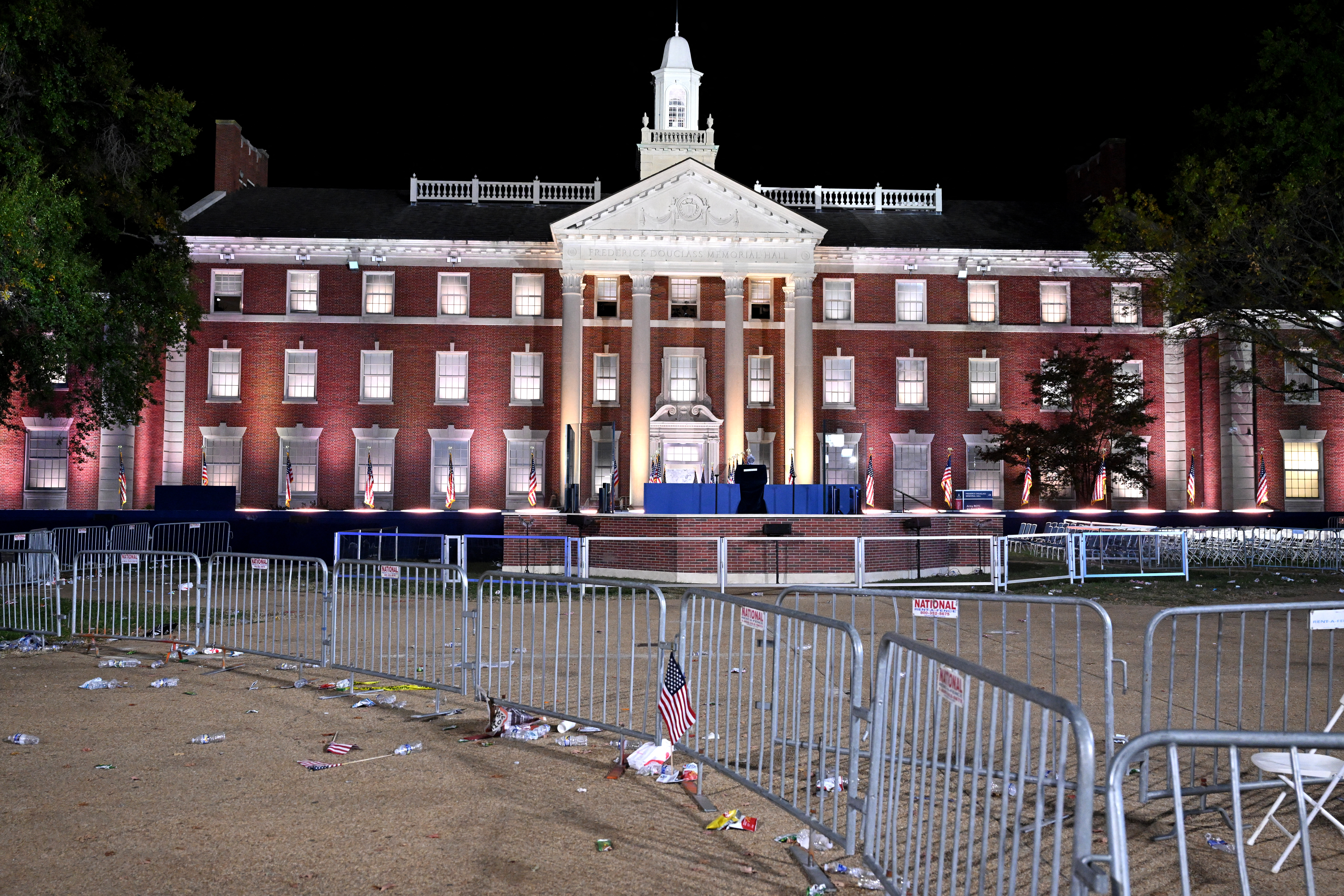 A US flag hangs from a fence after supporters left at an election night event for US Vice President and Democratic presidential candidate Kamala Harris at Howard University in Washington, DC, on November 6