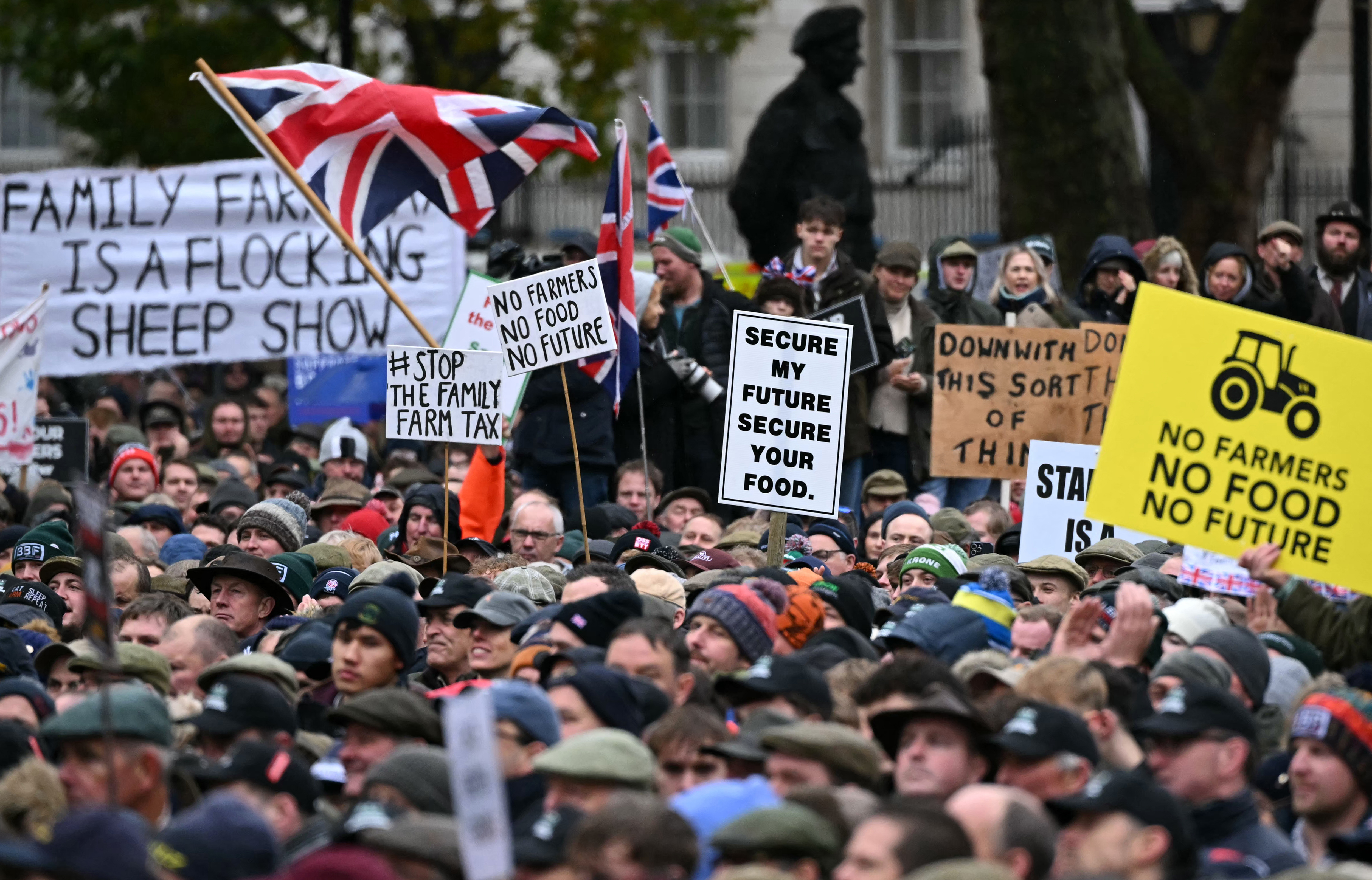Demonstrators listen to speakers during a farmers' protest 