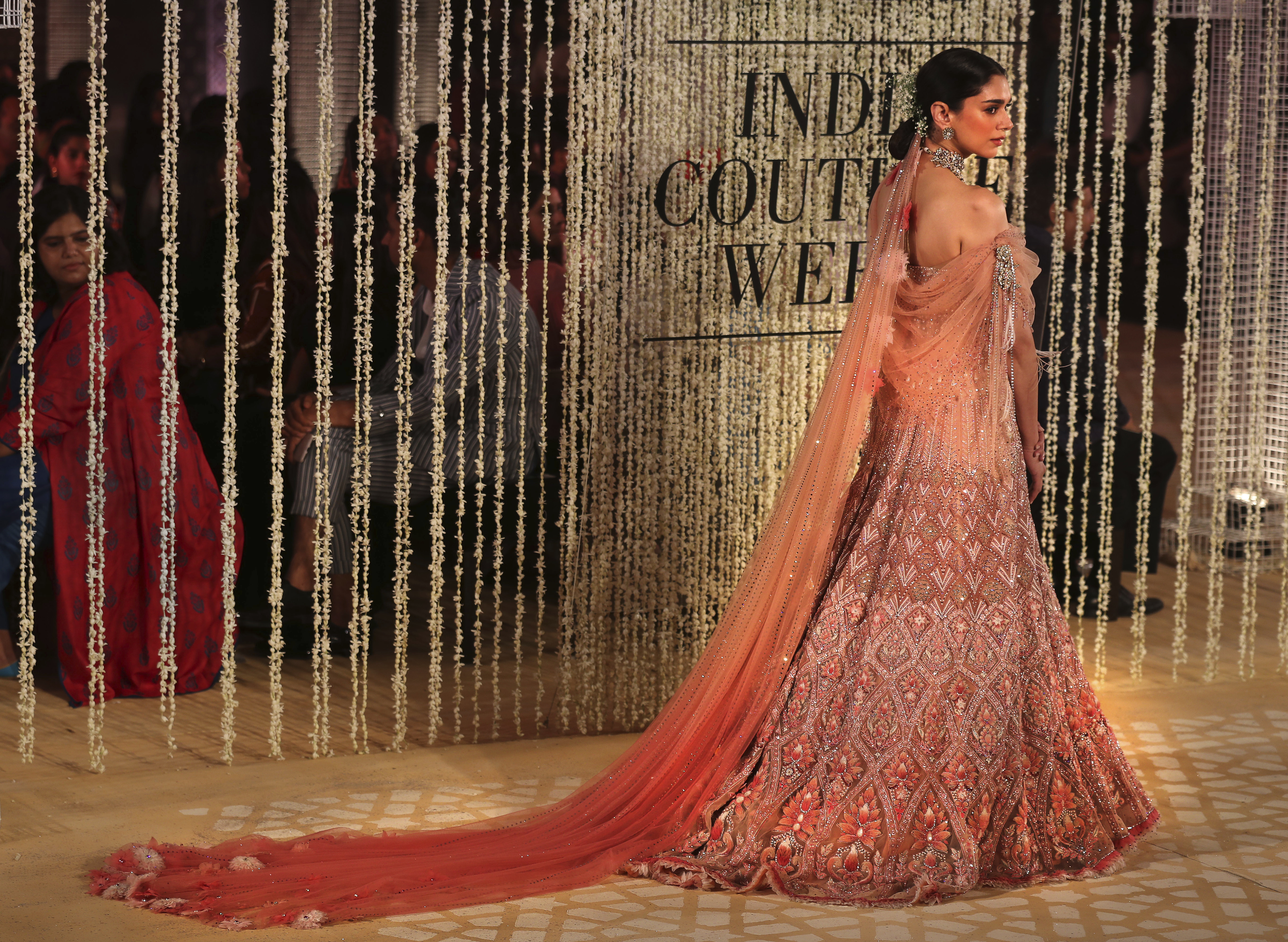 Bollywood actress Aditi Rao Hydari displays a creation of Indian designer Tarun Tahiliani during India Couture Week in New Delhi, India