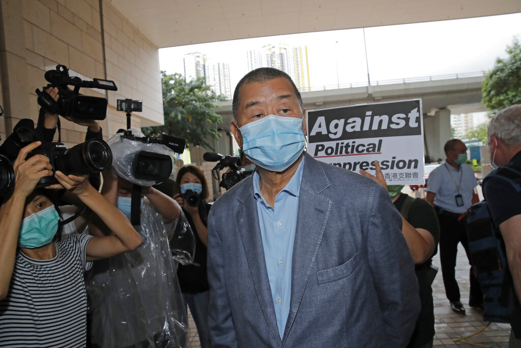 Various of groups of pro-democracy activists including Jimmy Lai , center, arrives at a court in Hong Kong, Tuesday, Sept. 15, 2020. Prominent activists Jimmy Lai and Joshua Wong were among more than two dozen activists appearing in court after being charged of participating in unlawful assembly. They were charged for joining a vigil last June 4 to commemorate the anniversary of the 1989 Tiananmen crackdown. While the event has been held every year, authorities did not grant permission for the gathering this year citing concerns over the spread of coronavirus. [AP Photo/Kin Cheung]