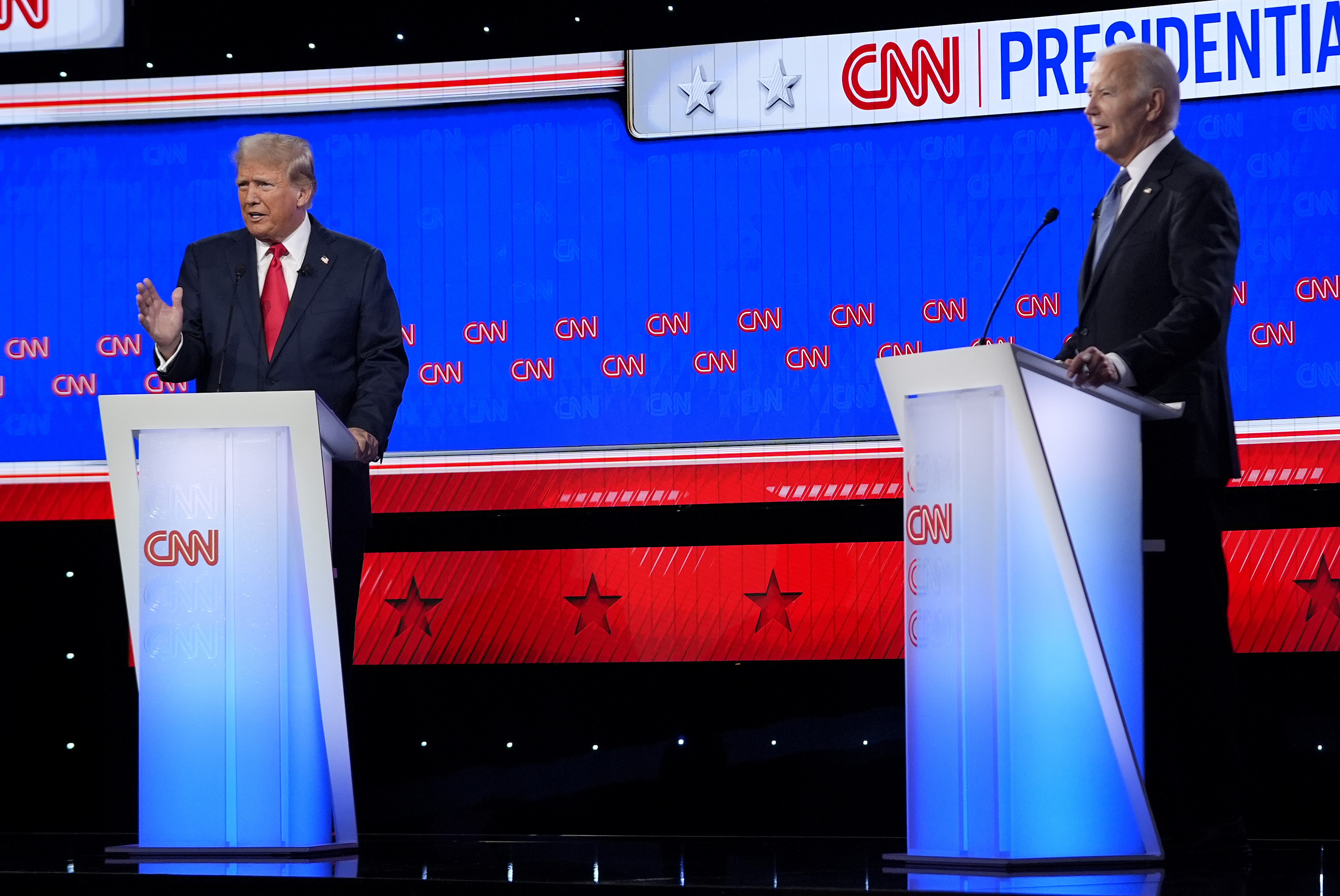 Donald Trump and Joe Biden face each other on a CNN debate stage.
