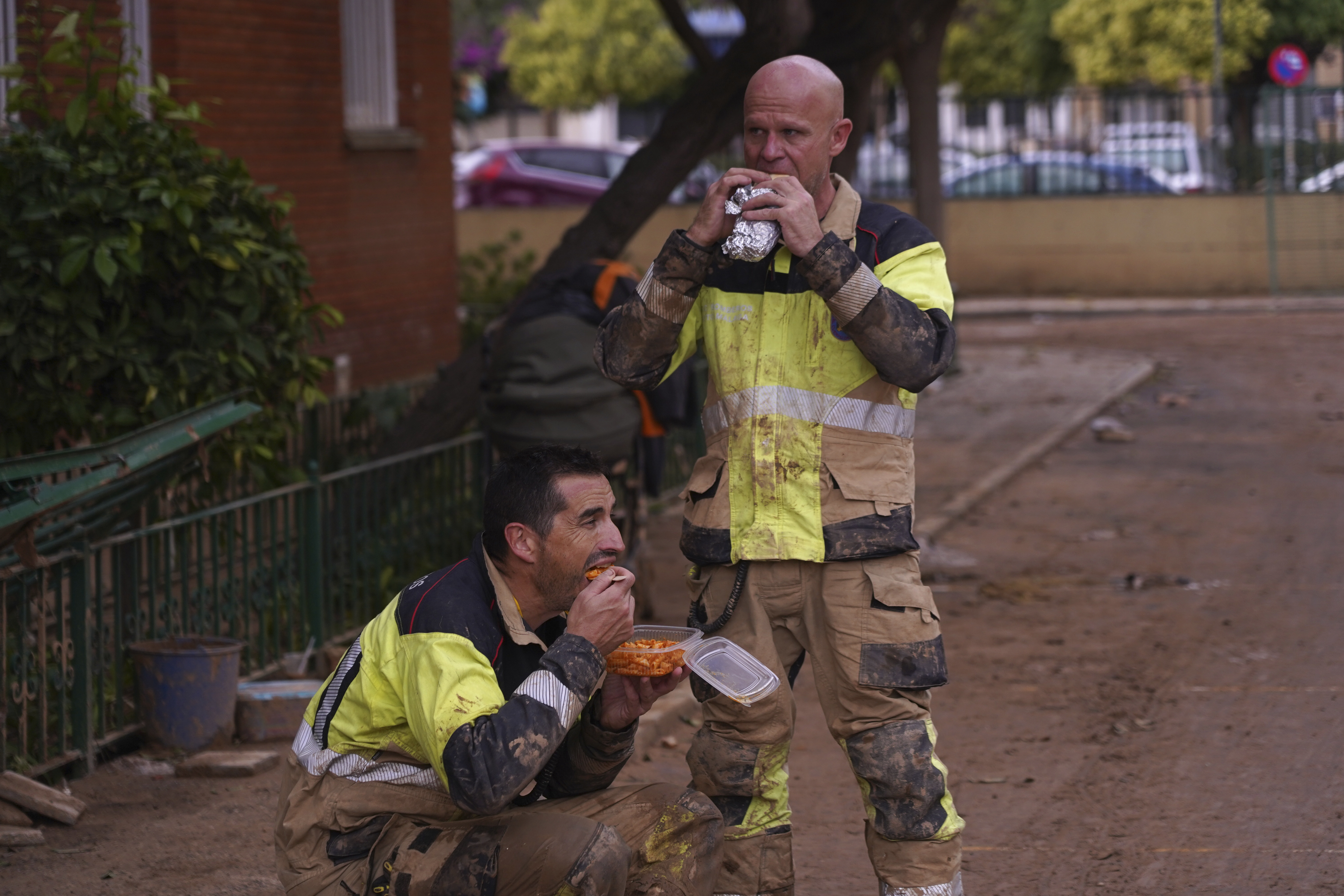 Heavy rains in Barcelona disrupt rail service as troops search for more flood victims in Valencia