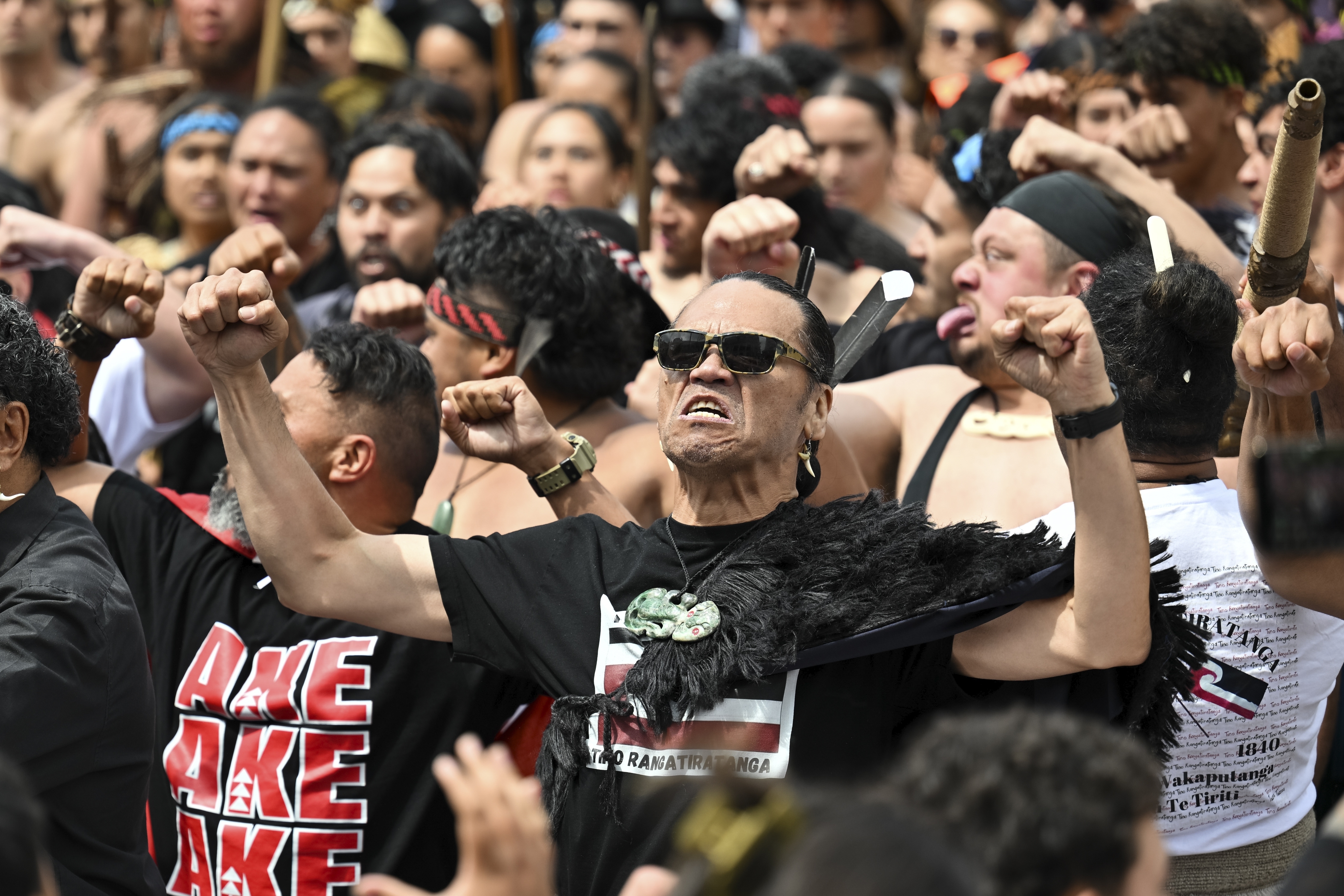 Indigenous Māori react outside New Zealand's parliament to protest against a proposed law that would redefine the country's founding agreement between Indigenous Māori and the British Crown, in Wellington, New Zealand, Tuesday, Nov. 19, 2024. (AP Photo/Mark Tantrum)