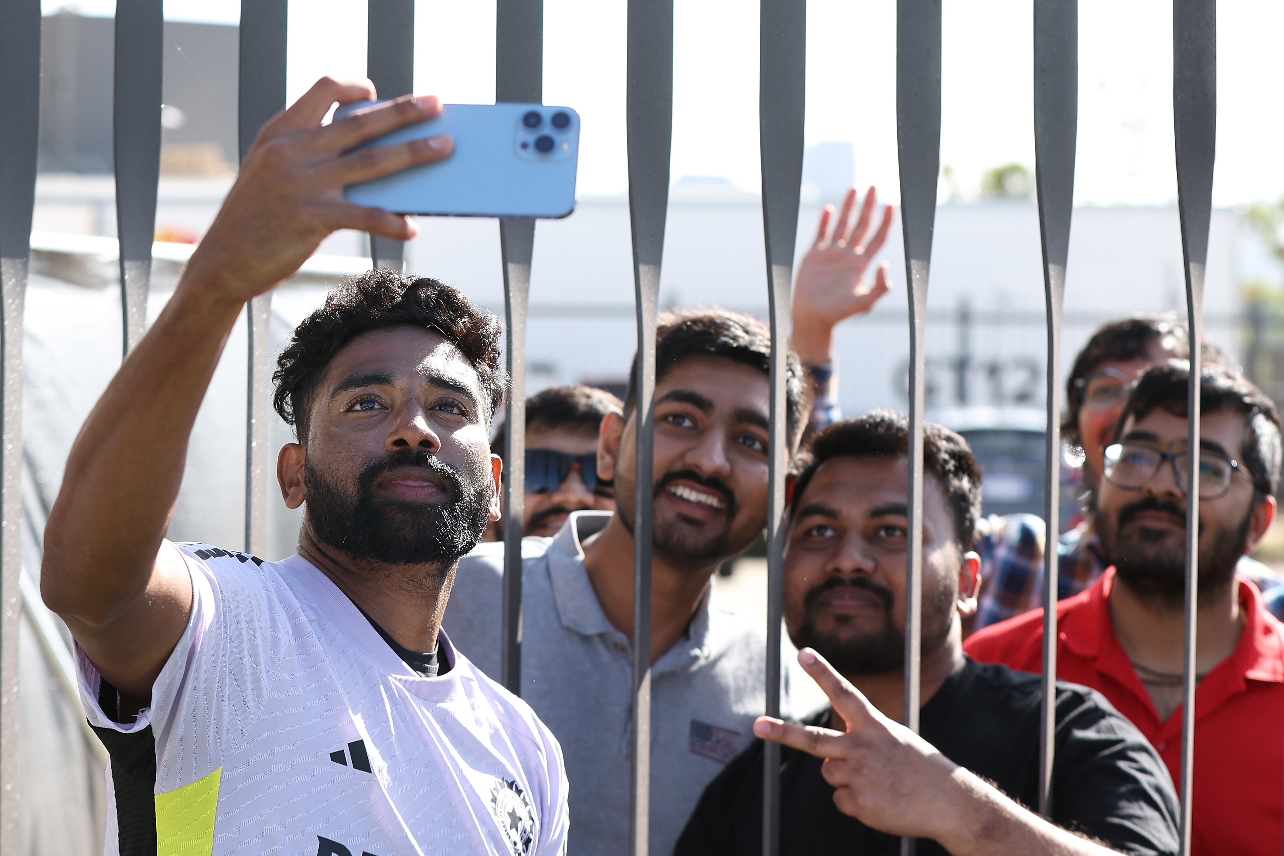 PERTH, AUSTRALIA - NOVEMBER 20: Mohammed Siraj of India takes a selfie for supporters after finishing in the nets during an India Test Squad training session at Optus Stadium on November 20, 2024 in Perth, Australia. (Photo by Paul Kane/Getty Images)