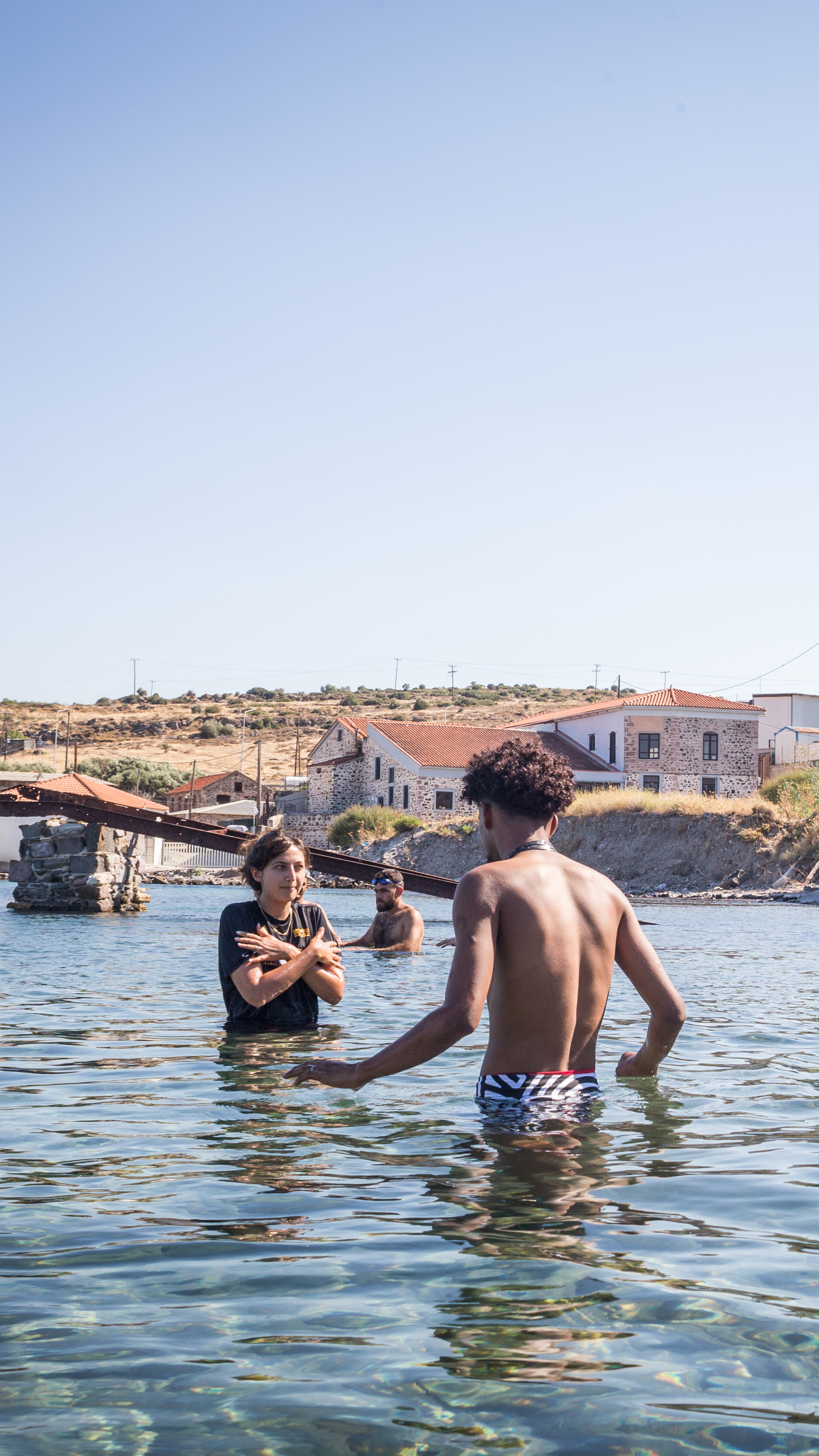 Mitali Desai, one of the US volunteer instructors, teaches the first lesson to course participants who are new to swimming. [Giacomo Sini/Al Jazeera]