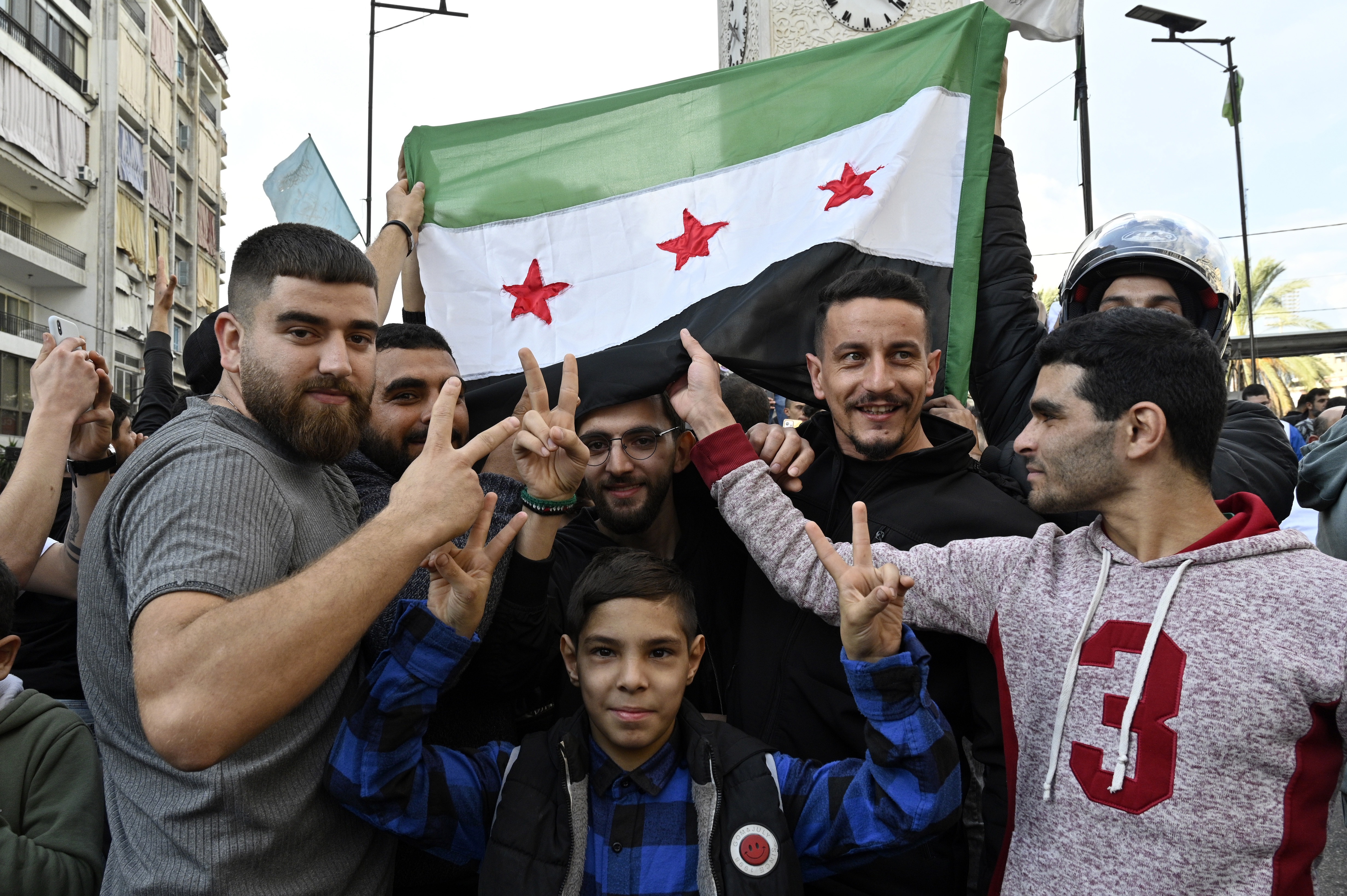 Syrian refugees celebrate the fall of Bashar al-Assad