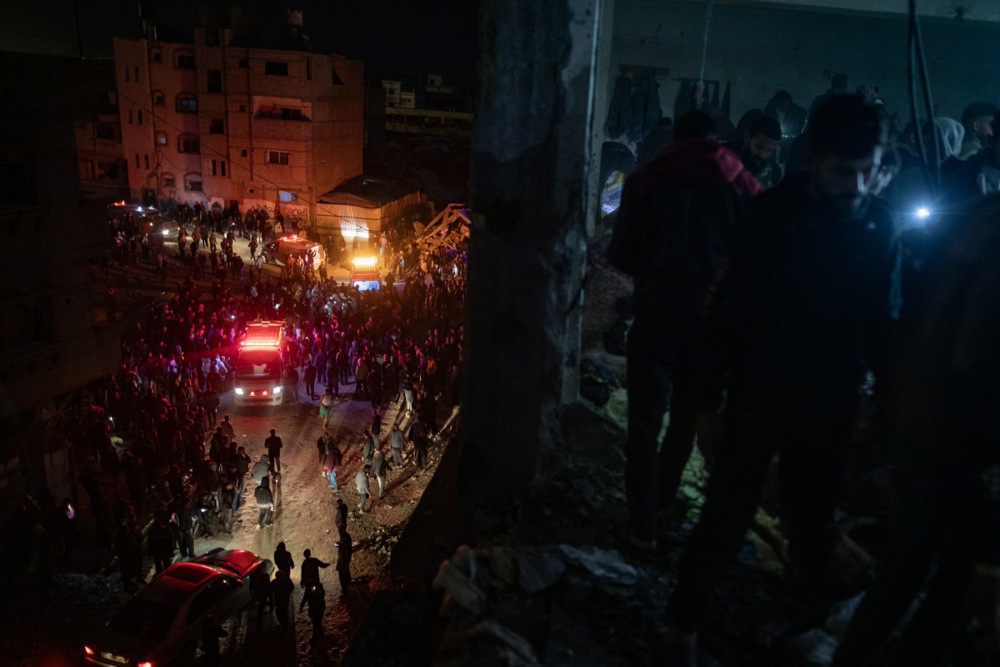 epa11779843 Palestinians inspect the site after an Israeli airstrike hit a UNRWA-run school sheltering displaced people, in Khan Yunis, southern Gaza Strip, 15 December 2024. According to medics at Nasser Hospital, at least 15 Palestinians were killed in the Israeli airstrike. More than 45,000 Palestinians and over 1,400 Israelis have been killed, according to the Palestinian Health Ministry and the Israeli Army, since Hamas militants launched an attack against Israel from the Gaza Strip on 07 October 2023, and the Israeli operations in Gaza and the West Bank which followed it. EPA-EFE/HAITHAM IMAD