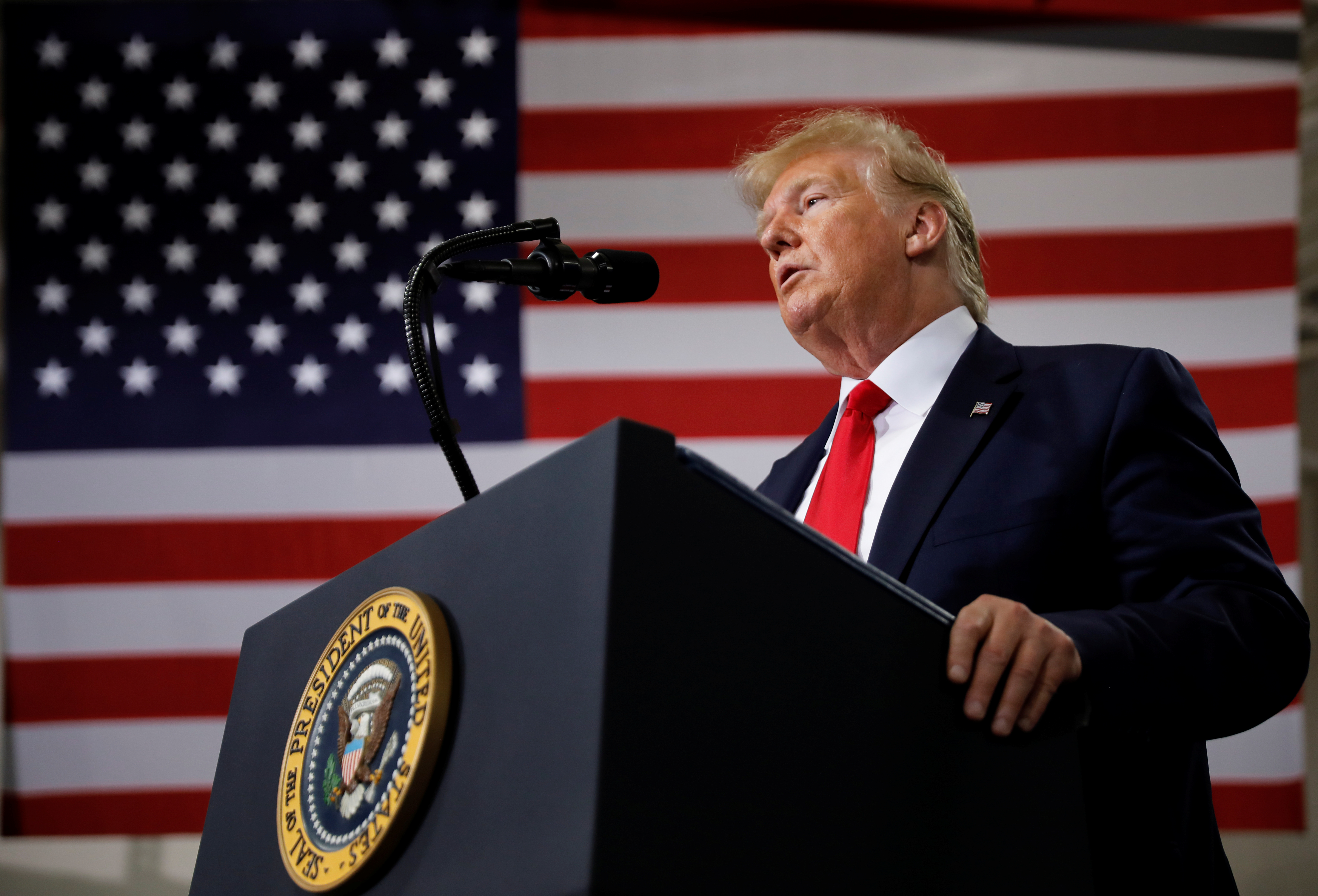 US President Donald Trump delivers remarks during a visit to Derco Aerospace Inc., a Lockheed Martin subsidiary, in Milwaukee, Wisconsin [File: Carlos Barria/Reuters]