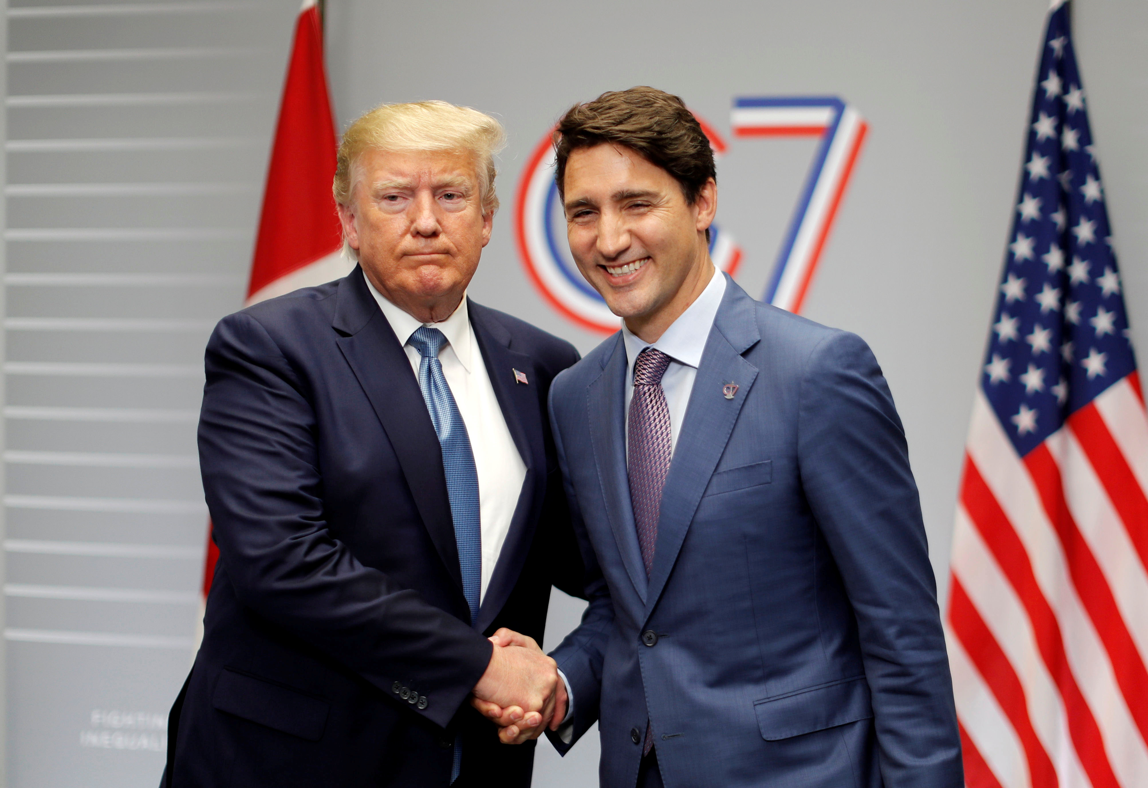 Trump and Trudeau shake hands at the G7 summit in France in 2019