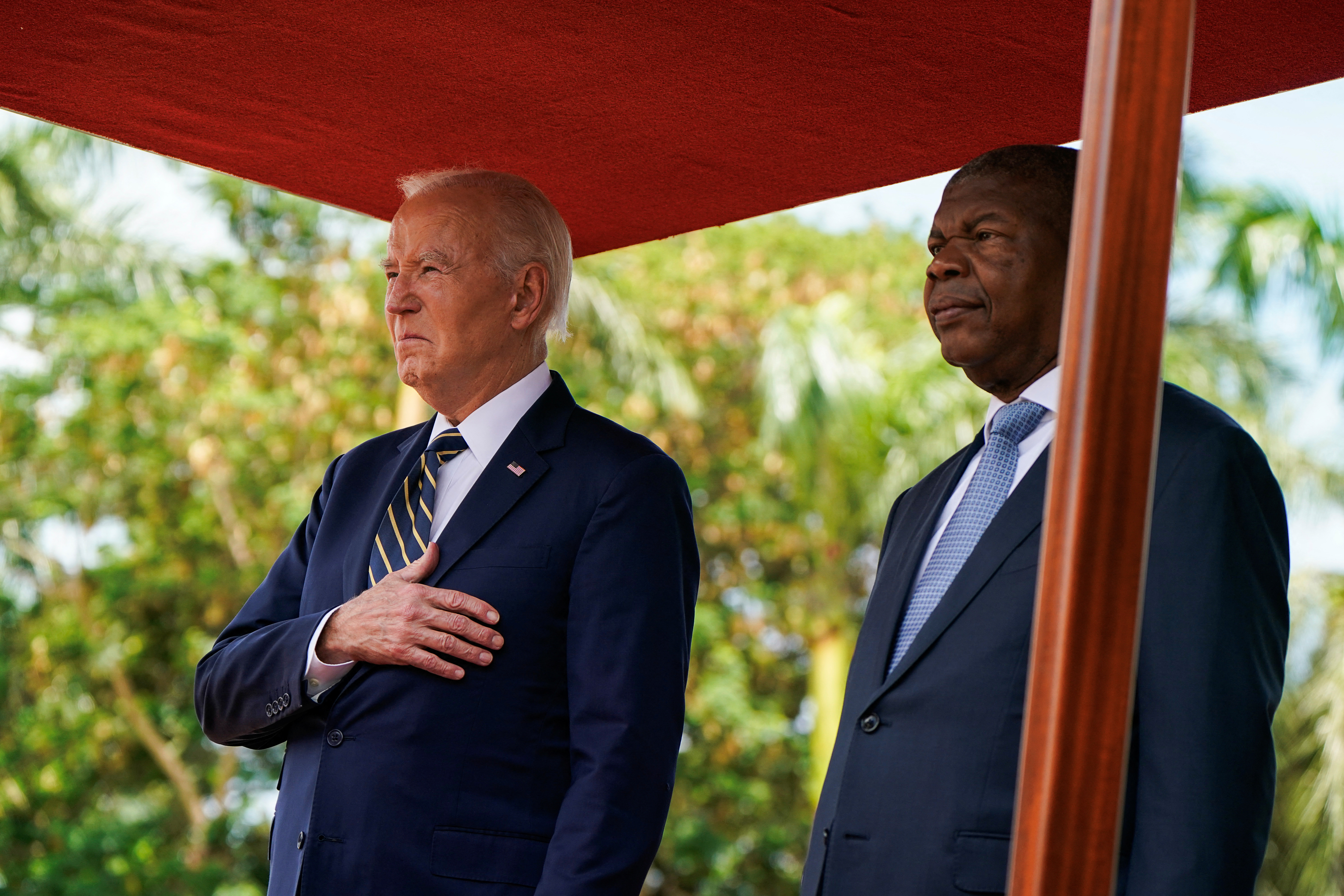 US President Joe Biden stands with Angolan President Joao Manuel Goncalves Lourenco at the Presidential Palace in Luanda, Angola, December 3, 2024 [Elizabeth Frantz/Reuters]