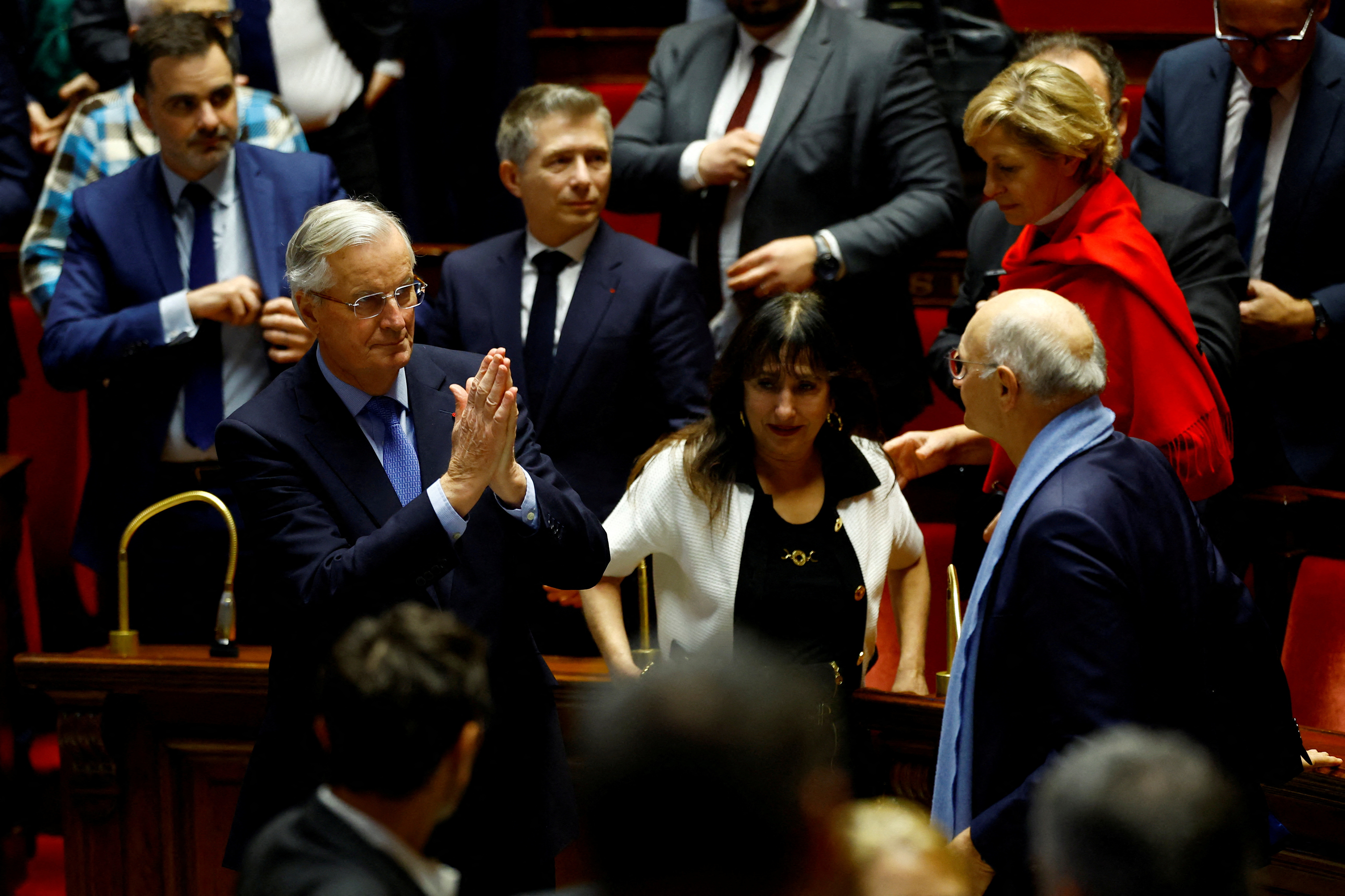 French Prime Minister Michel Barnier reacts after the result of the vote on the first motion of no-confidence against the French government, tabled by the alliance of left-wing parties the "Nouveau Front Populaire"