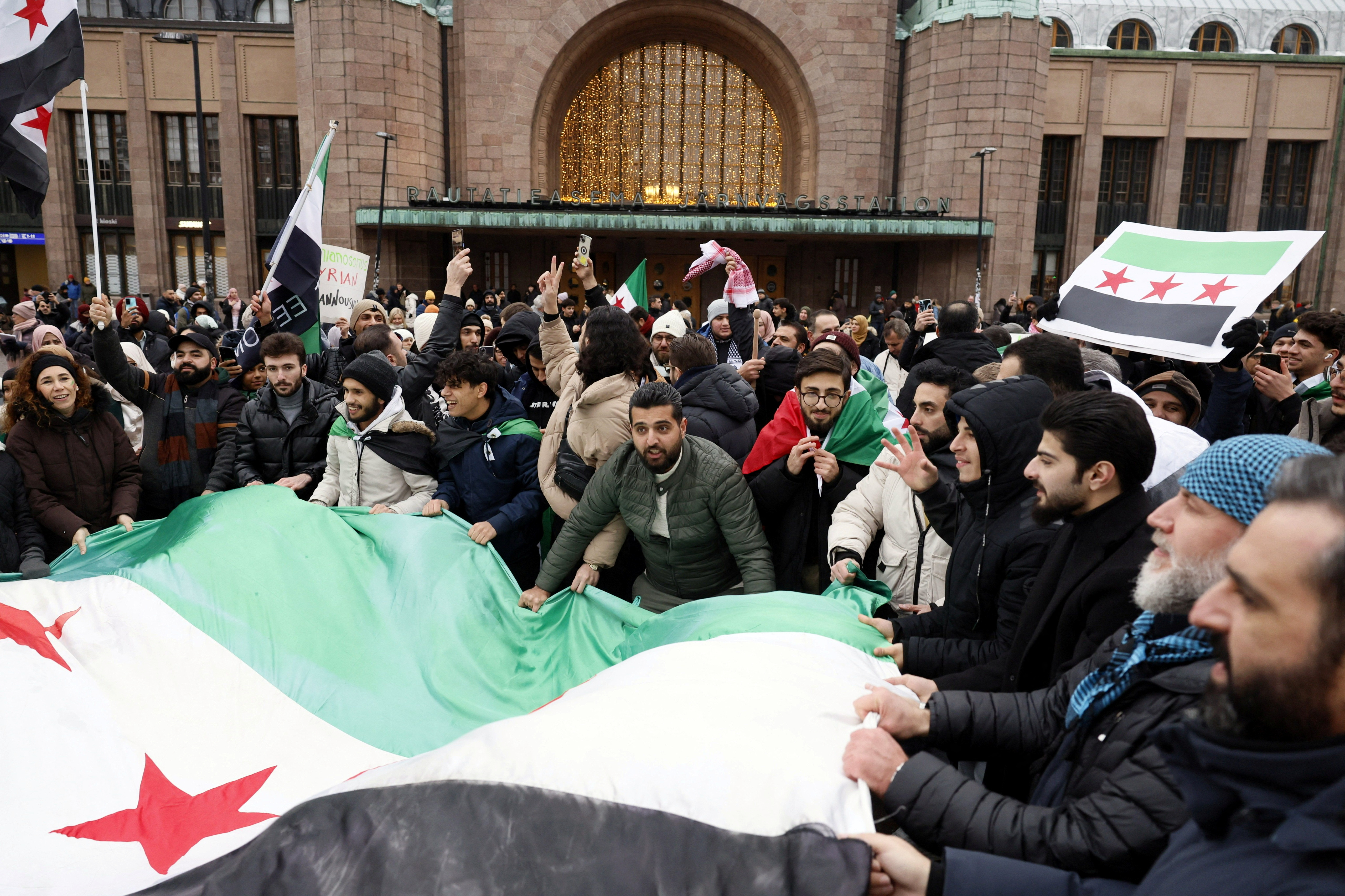 Syrians hold flag