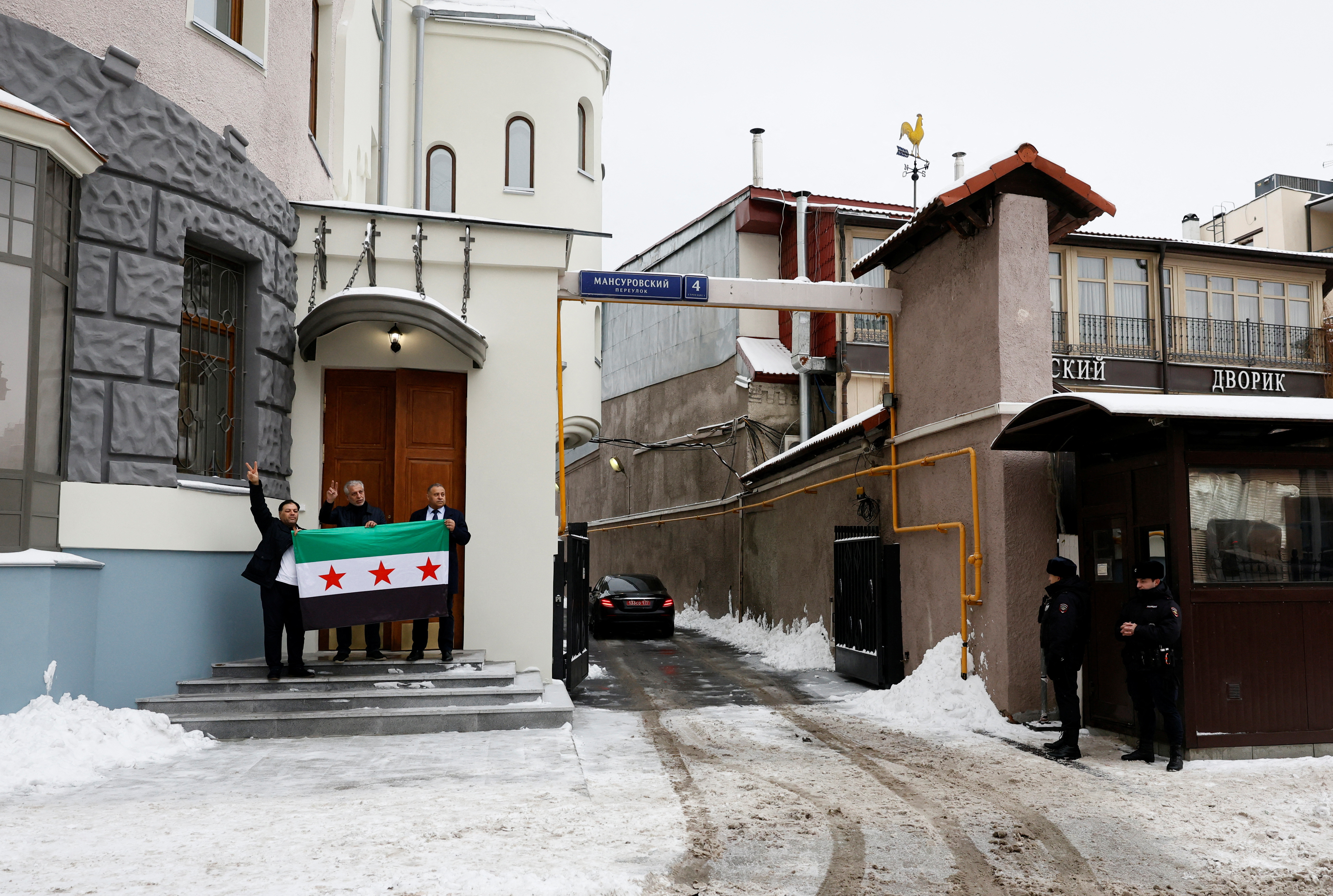 Images with the Syrian opposition flag raised at the embassy in Moscow