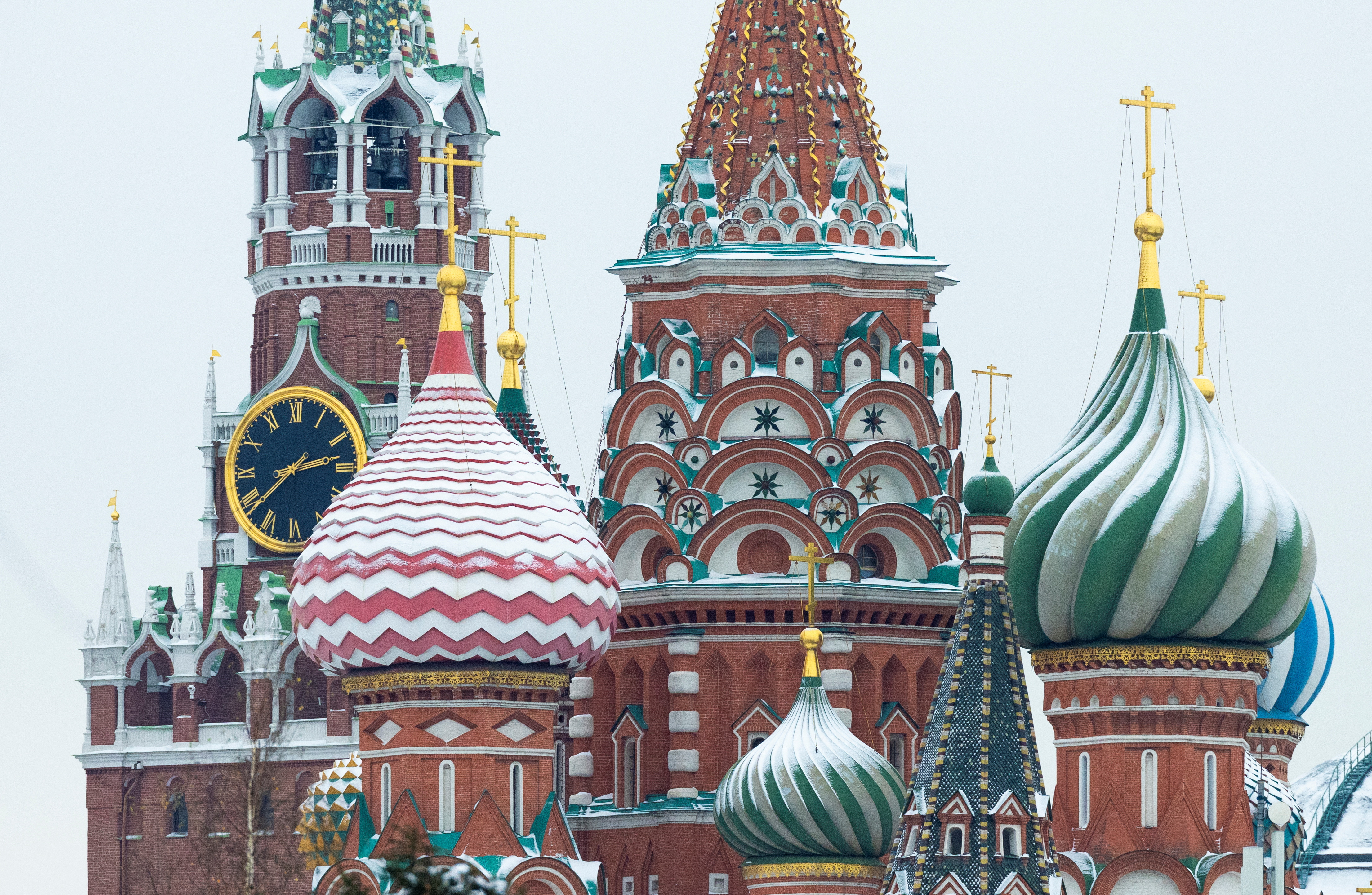A view shows the Spasskaya tower of the Kremlin behind St. Basil’s Cathedral.