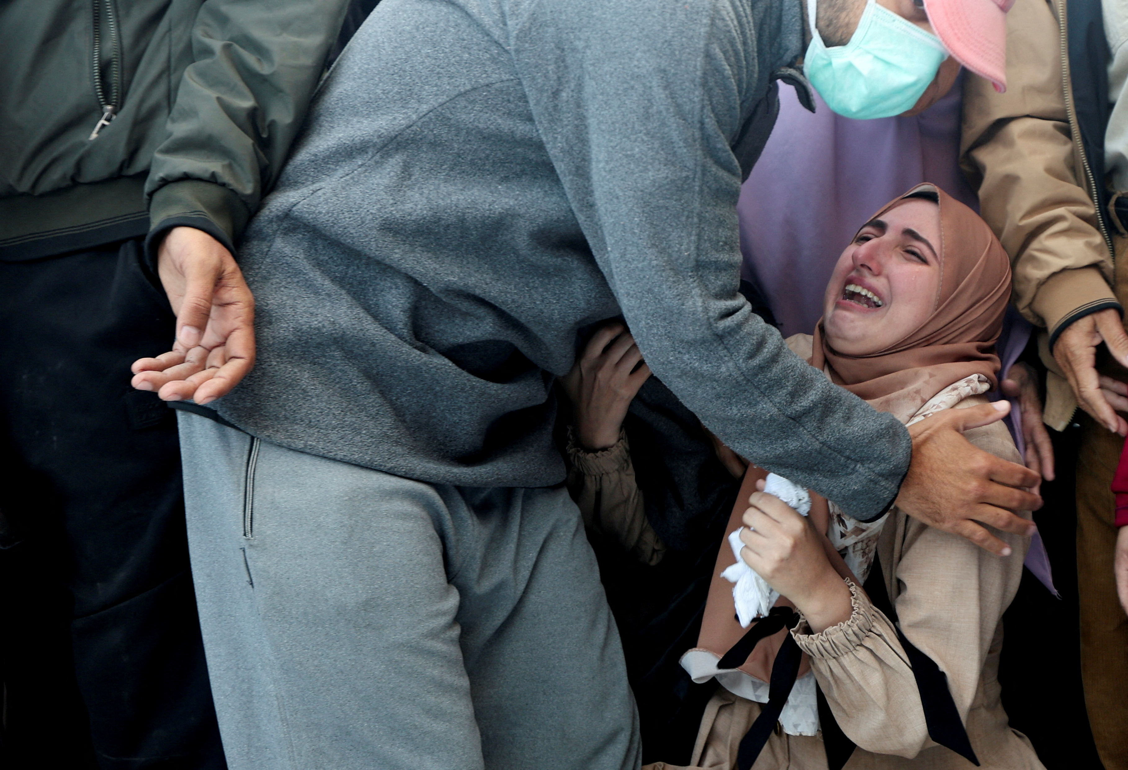 A woman cries at the funeral of Palestinians killed in Israeli attacks on Gaza