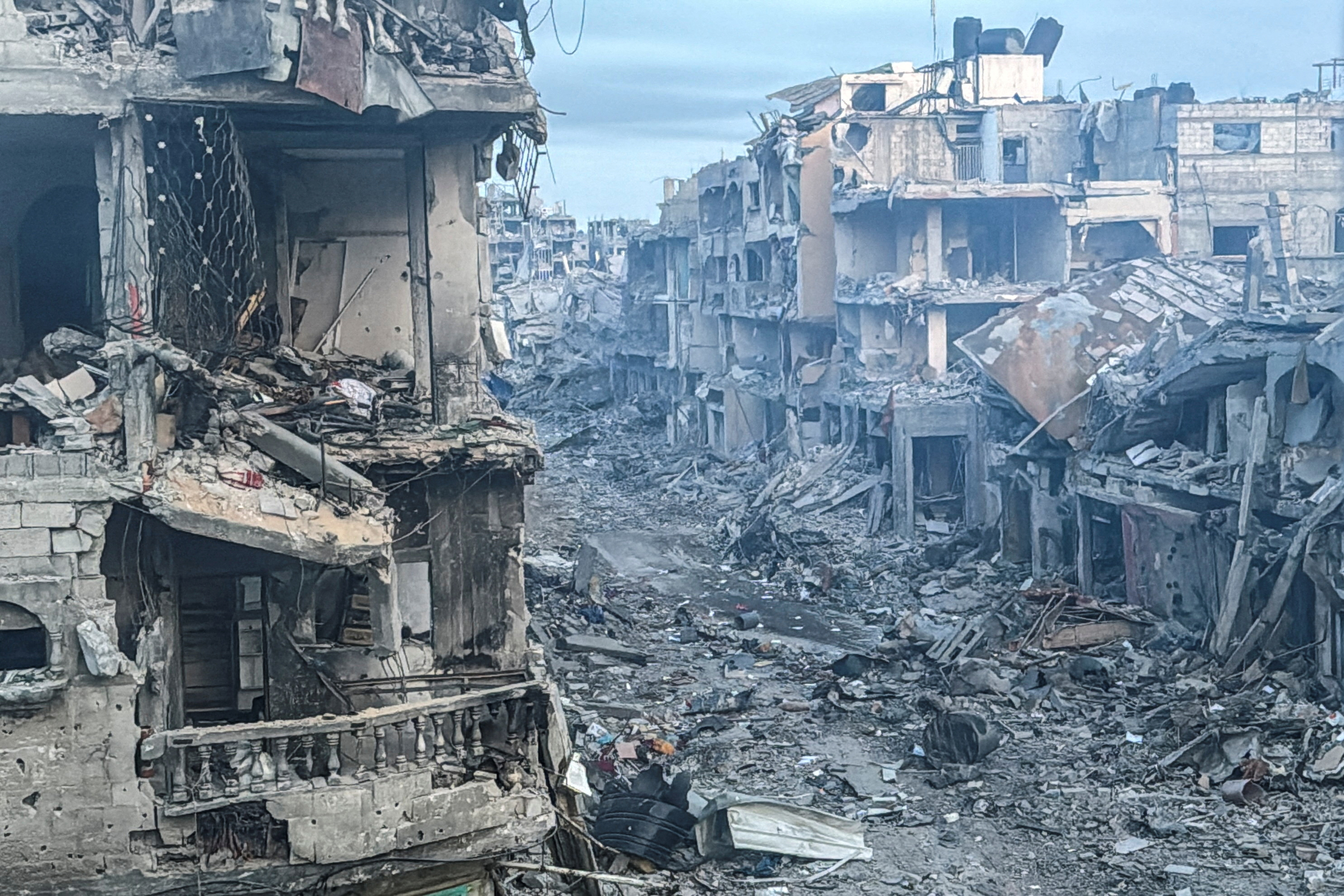 Palestinian houses stand badly damaged by Israeli Attacks