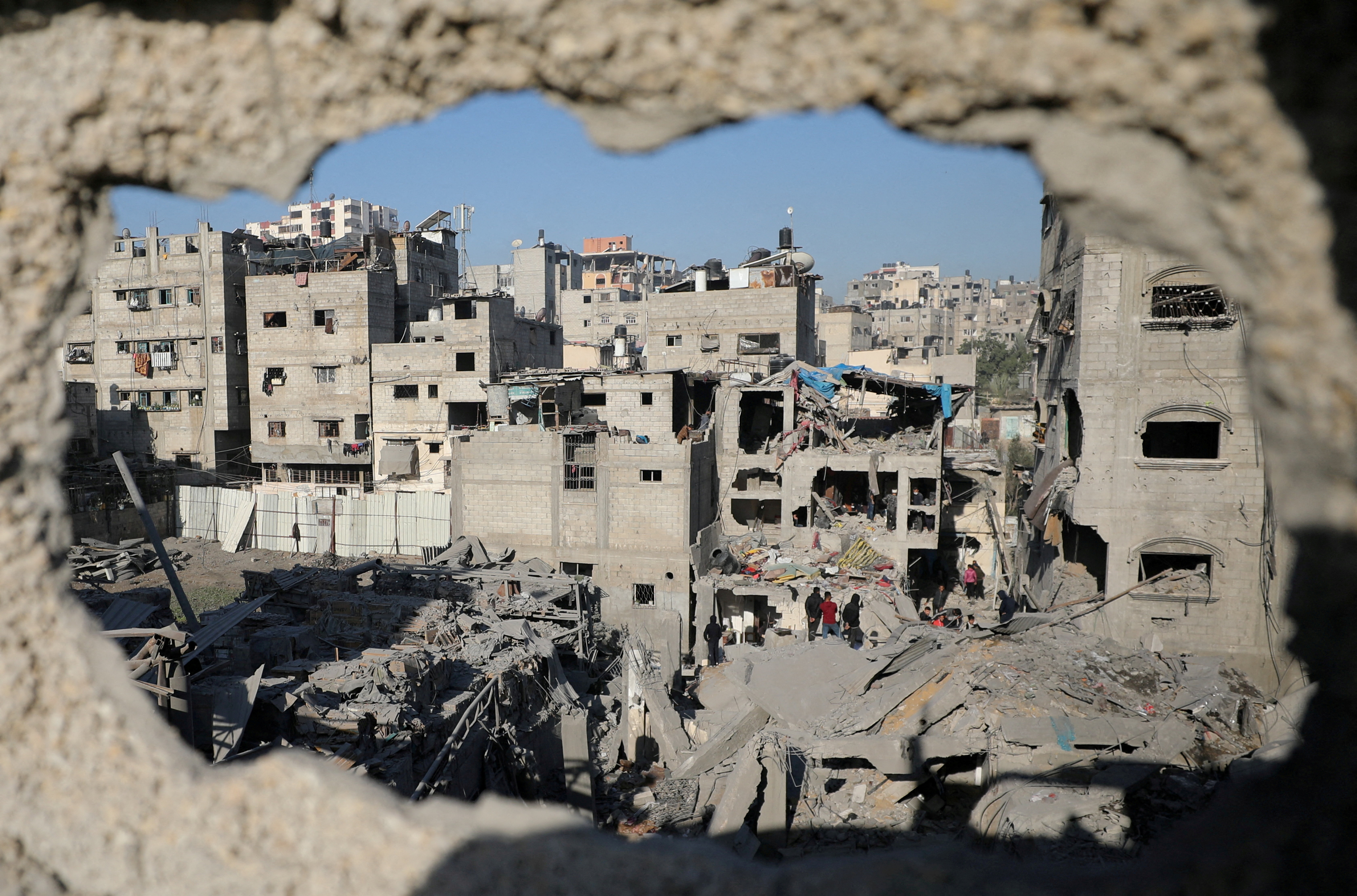 Palestinians inspect the site of an Israeli airstrike on a house, amid the ongoing conflict between Israel and Hamas, in Gaza City, December 19, 2024. [Dawoud Abu Alkas/Reuters]