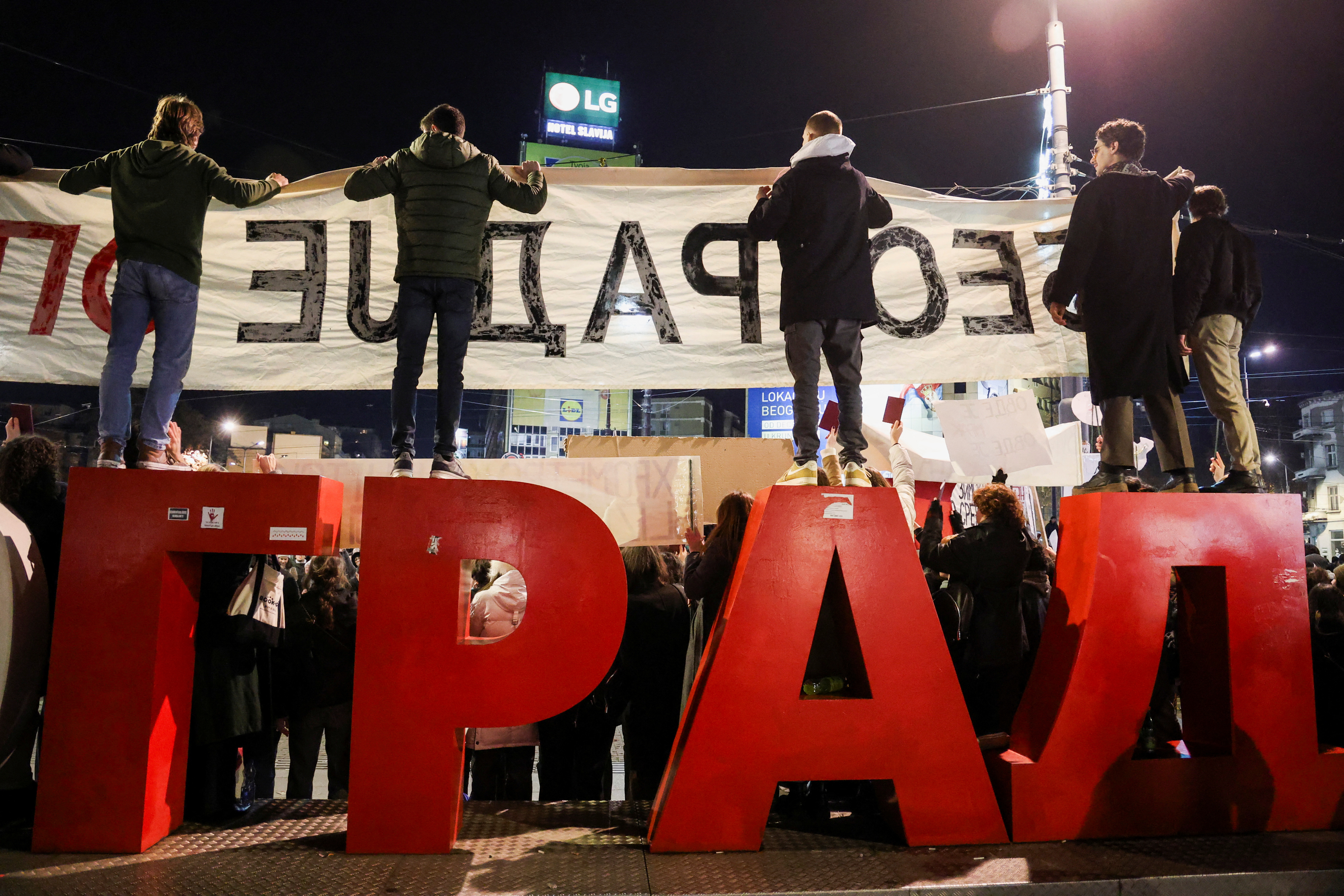 People attend a protest against government policies, corruption and the negligence which they blame for the deaths of the victims in the Novi Sad railway station disaster in November, in Belgrade, Serbia