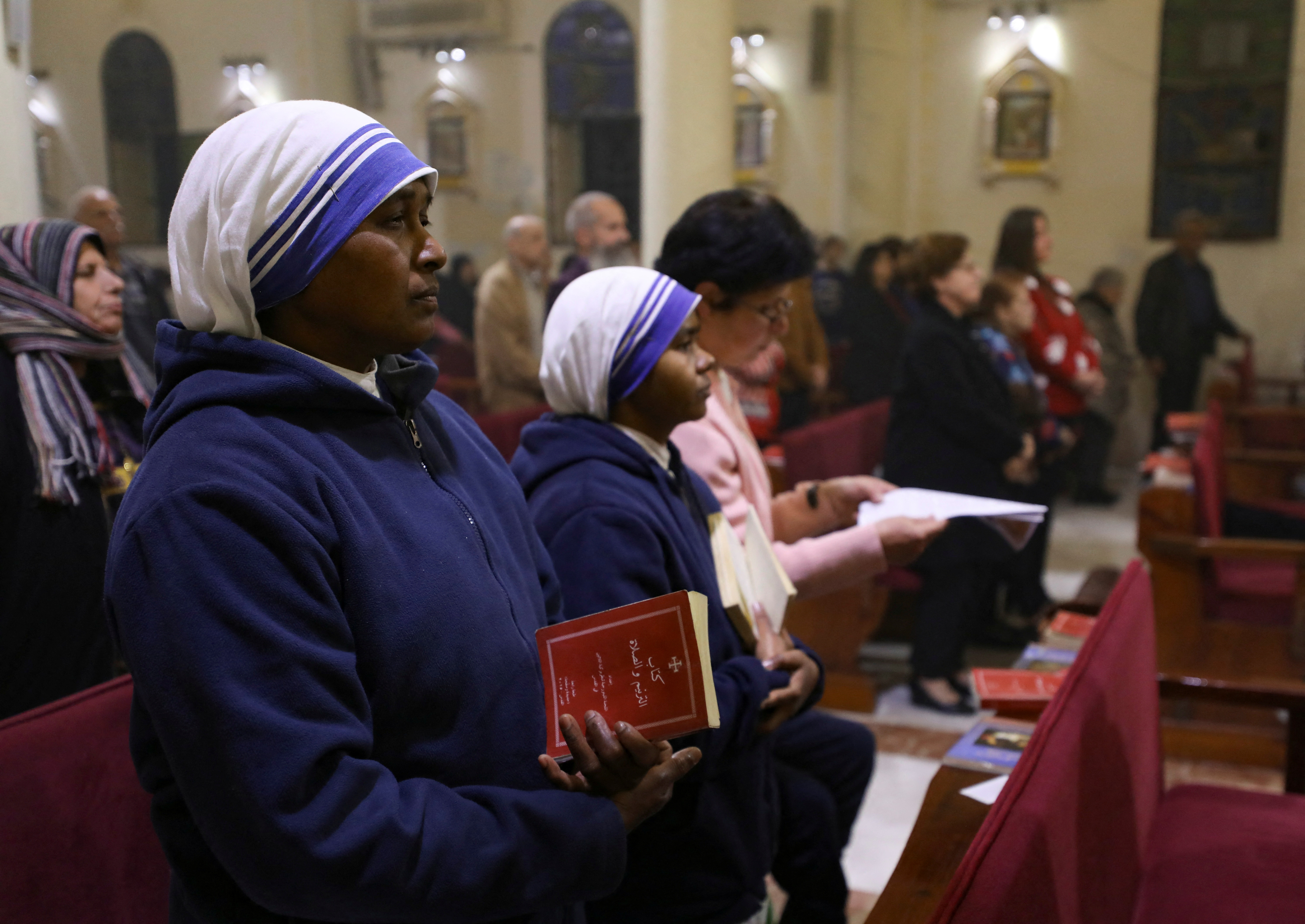 Christians attend a mass on Christmas Eve, amid the Israel-Hamas conflict, at the Holy Family Church in Gaza City, December 24