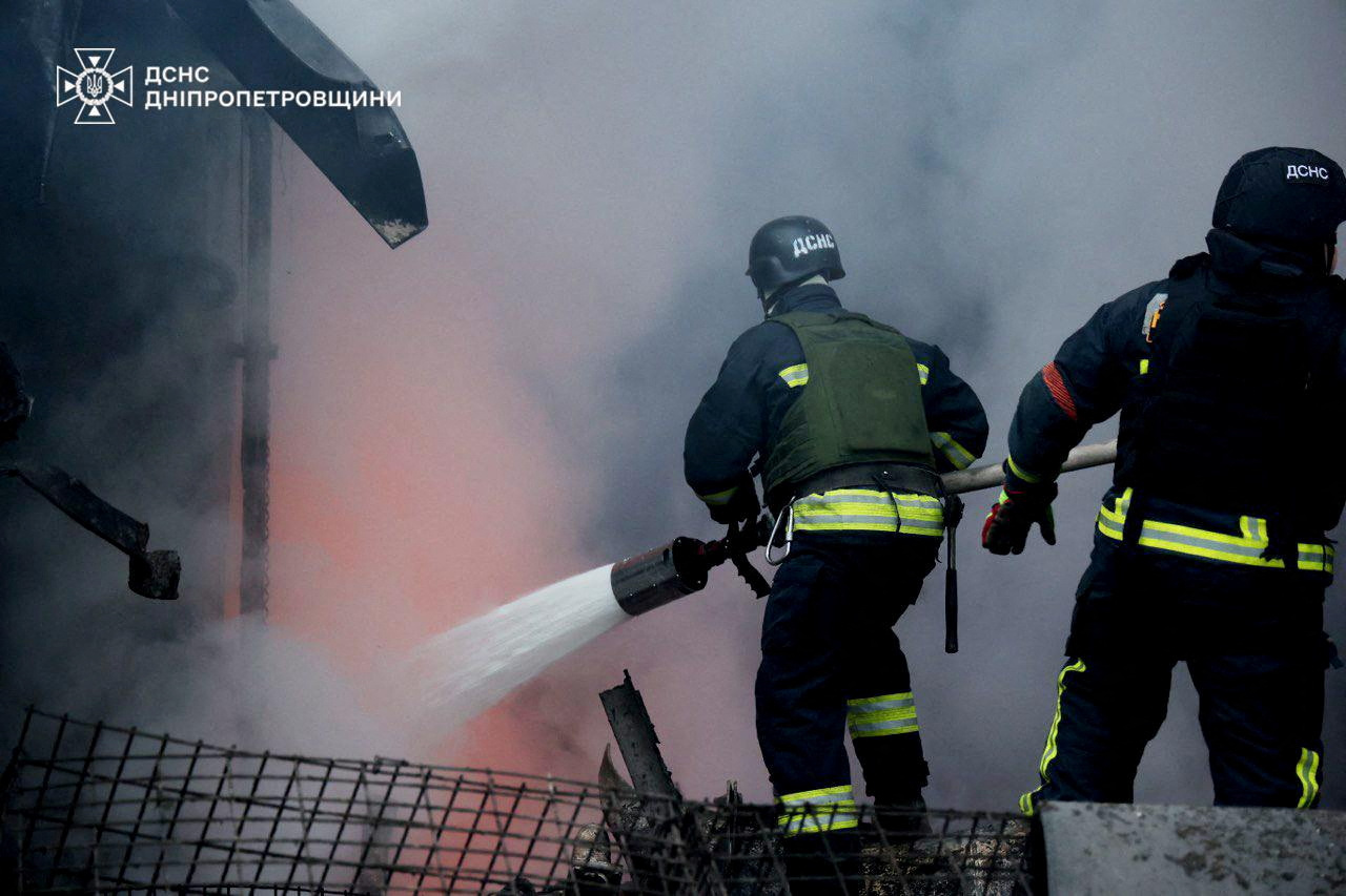Firefighters work at a site of a Russian missile strike, amid Russia's attack on Ukraine, in Dnipropetrovsk region, Ukraine December 25, 2024.