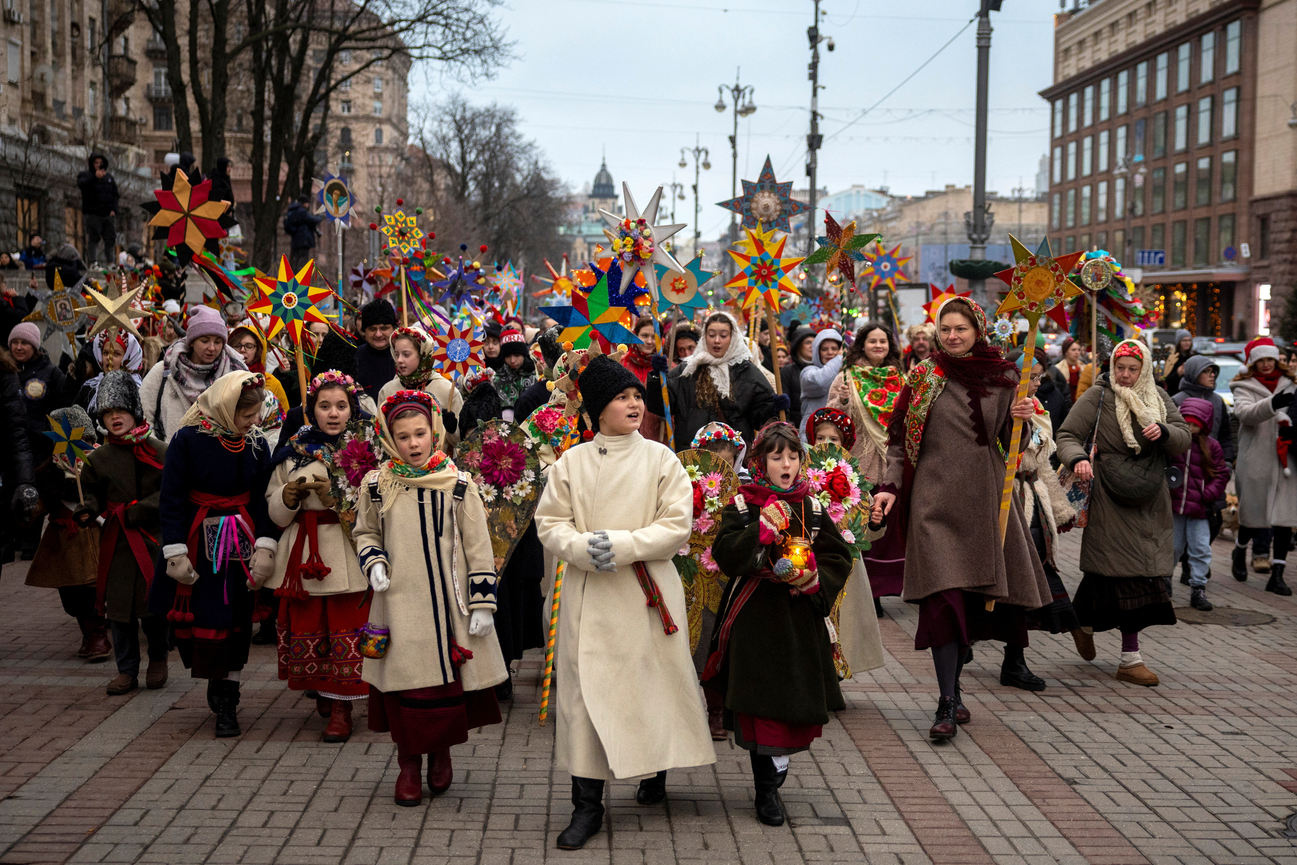 People wear traditional Ukrainian clothes as they mark Christmas Day with a carol singing event, amid Russia's attack on Ukraine, in Kyiv, Ukraine, December 25