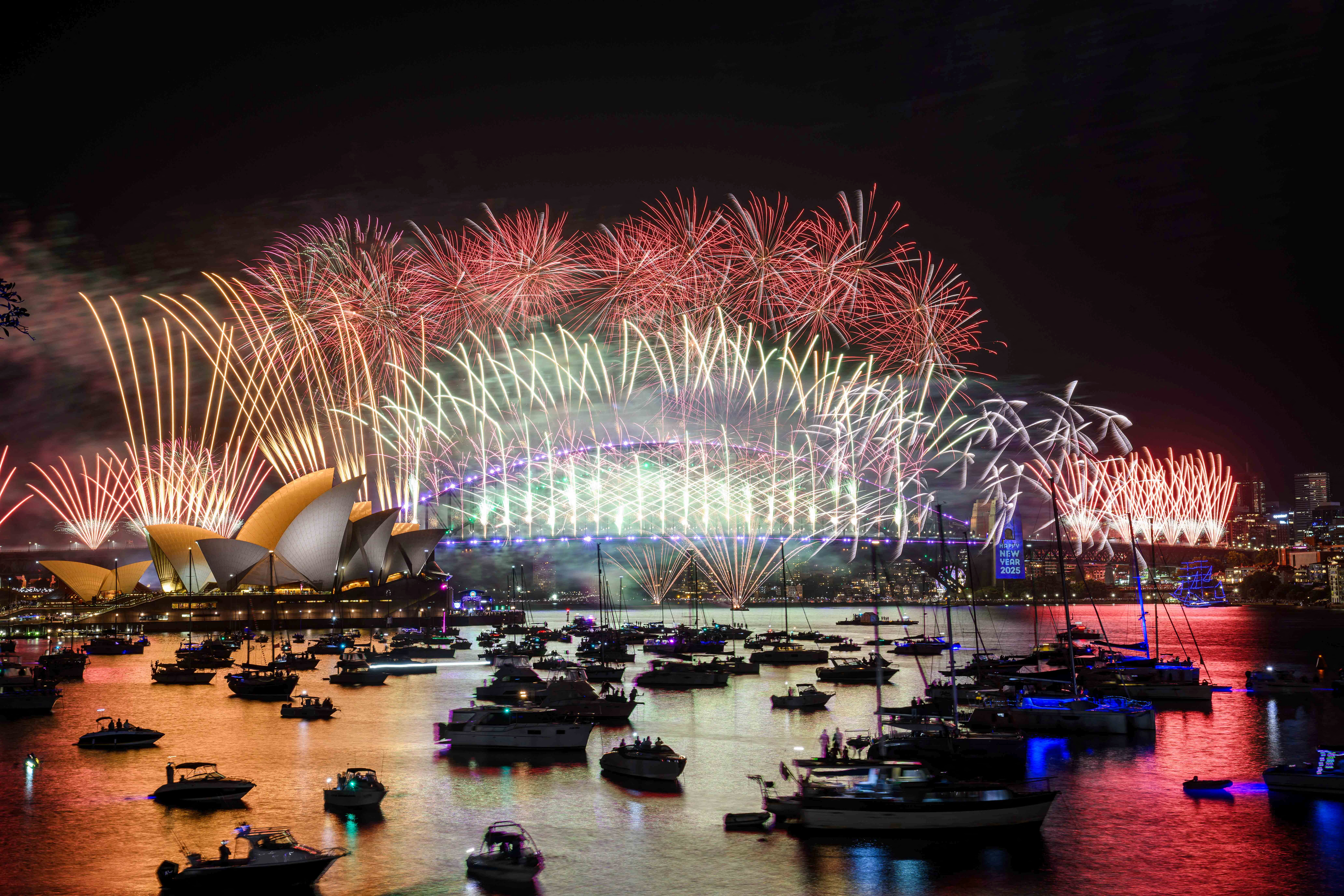 Fireworks explode over the Sydney Opera House and Harbour Bridge during New Year’s Eve celebrations in Sydney, Australia, December 31