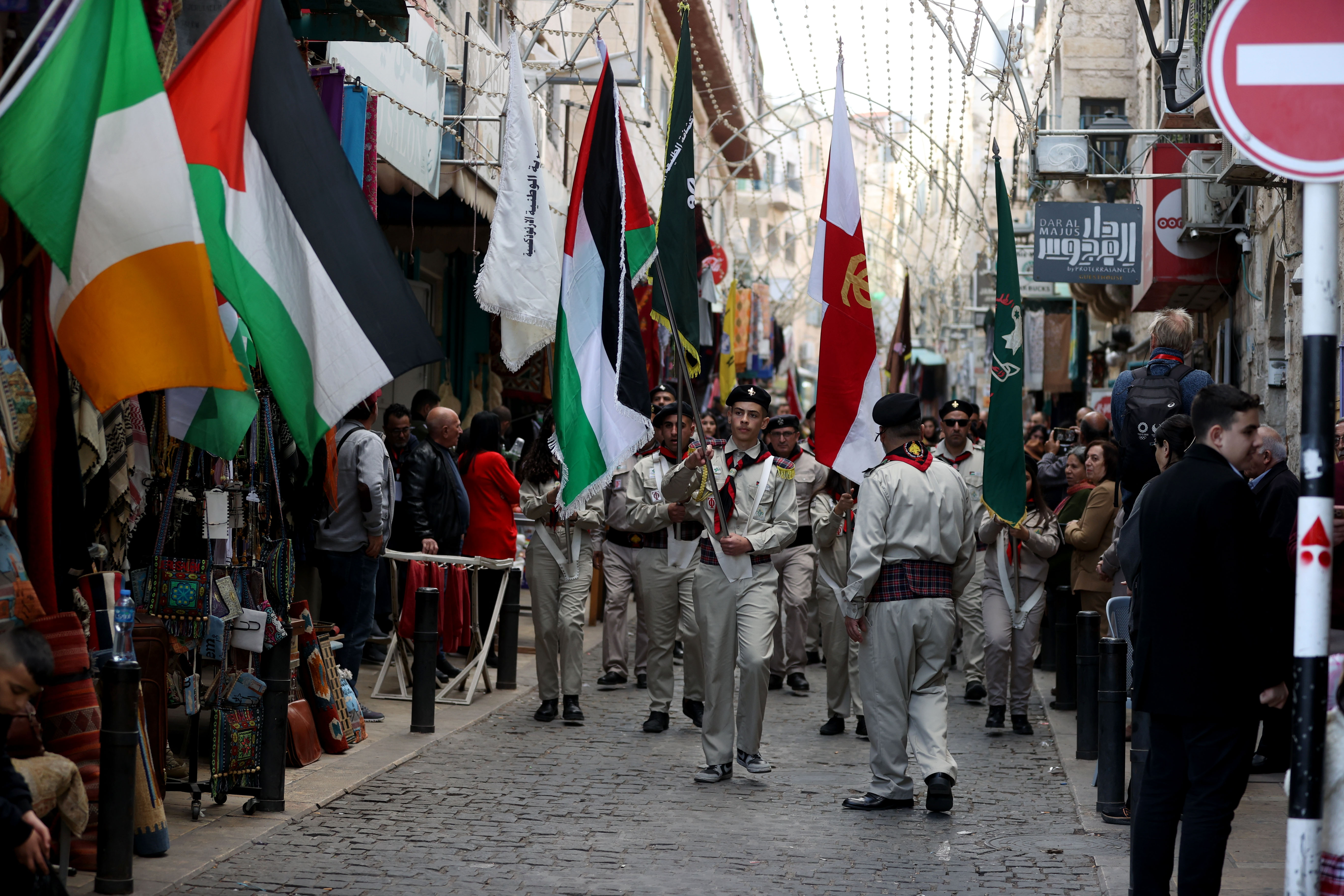 Palestinian marching band stage a silent march in the street near the Church of Nativity as Christians prepared to mark its second bleak Christmas due to the ongoing war in Gaza, in Bethlehem, West Bank on December 24