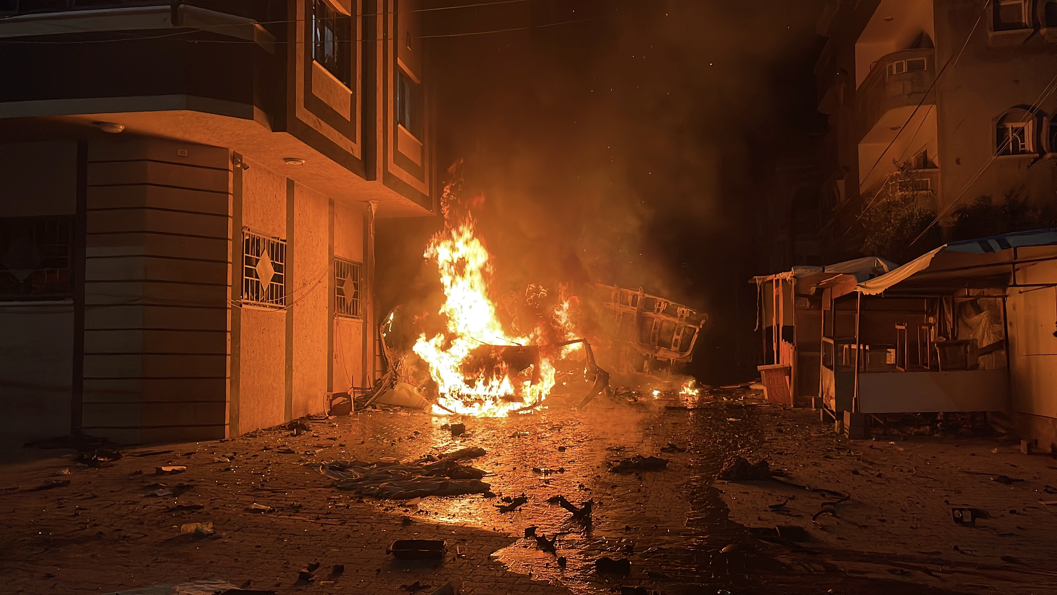 Israeli forces hit the live broadcasting vehicle of Al-Quds al-Youm TV at the Nuseirat refugee camp in Gaza City