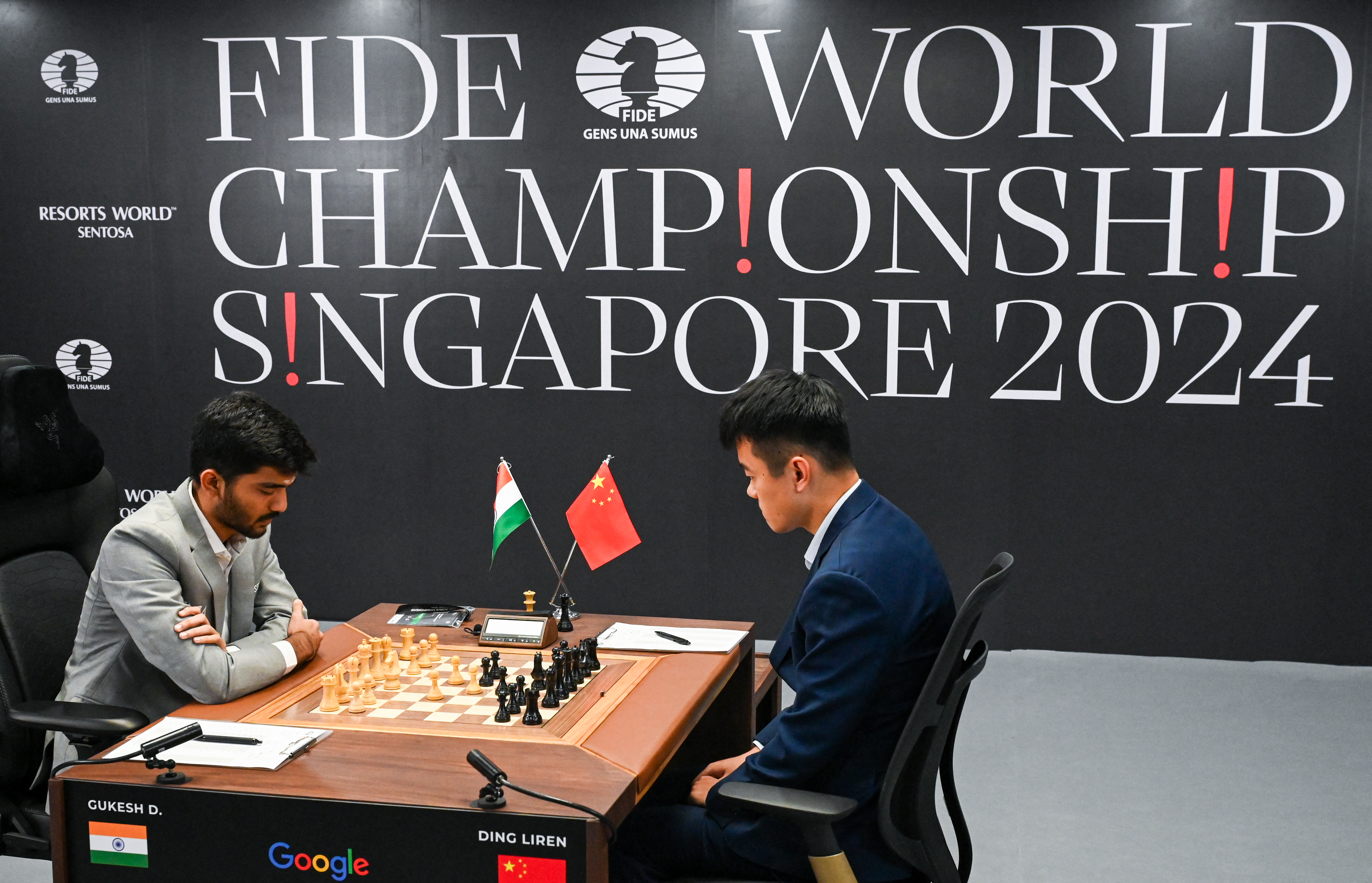 Chess players at table.