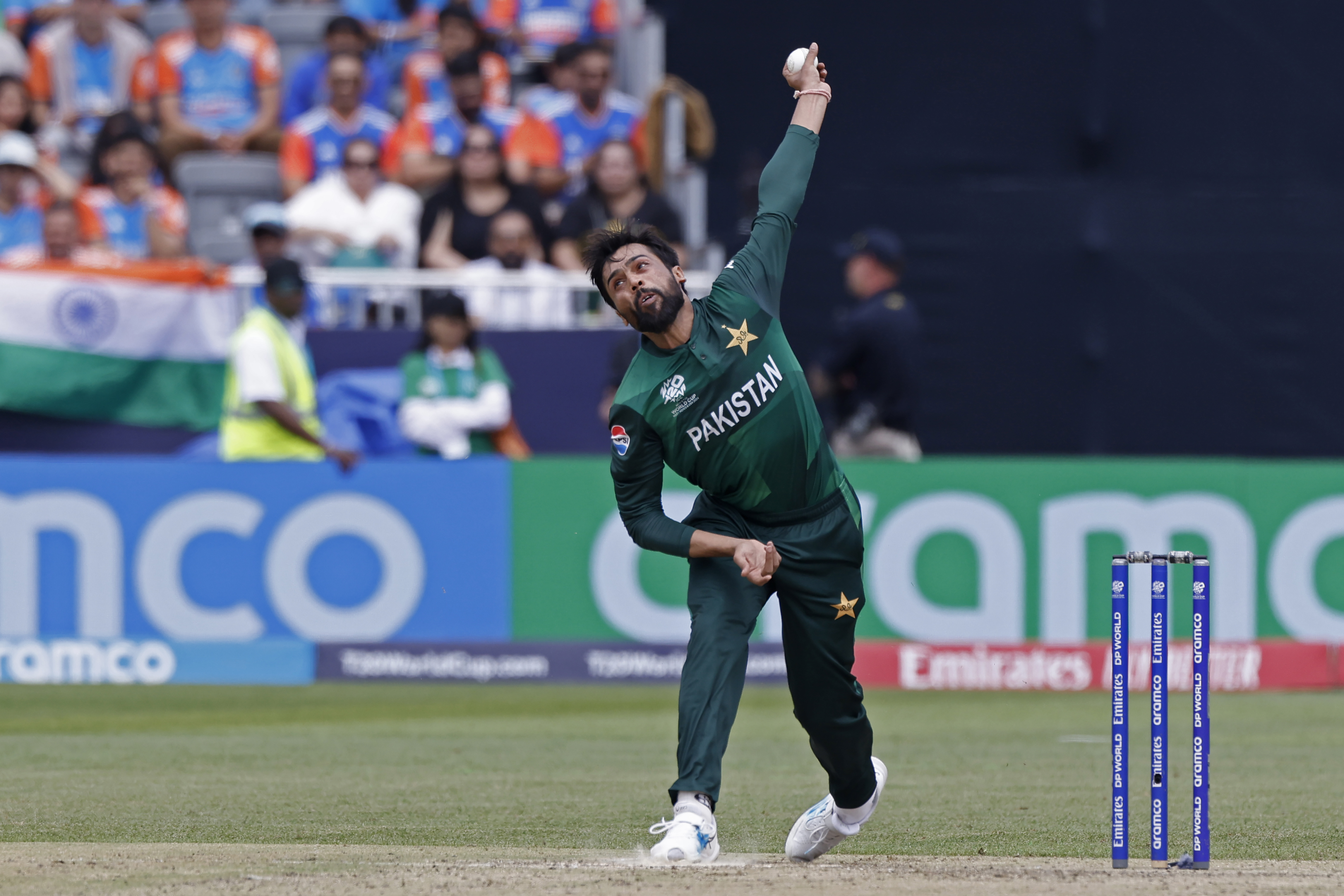 Pakistan's Mohammad Amir bowls a delivery during the ICC Men's T20 World Cup cricket match between India and Pakistan at the Nassau County International Cricket Stadium in Westbury, New York, Sunday, June 9, 2024. (AP Photo/Eduardo Munoz)