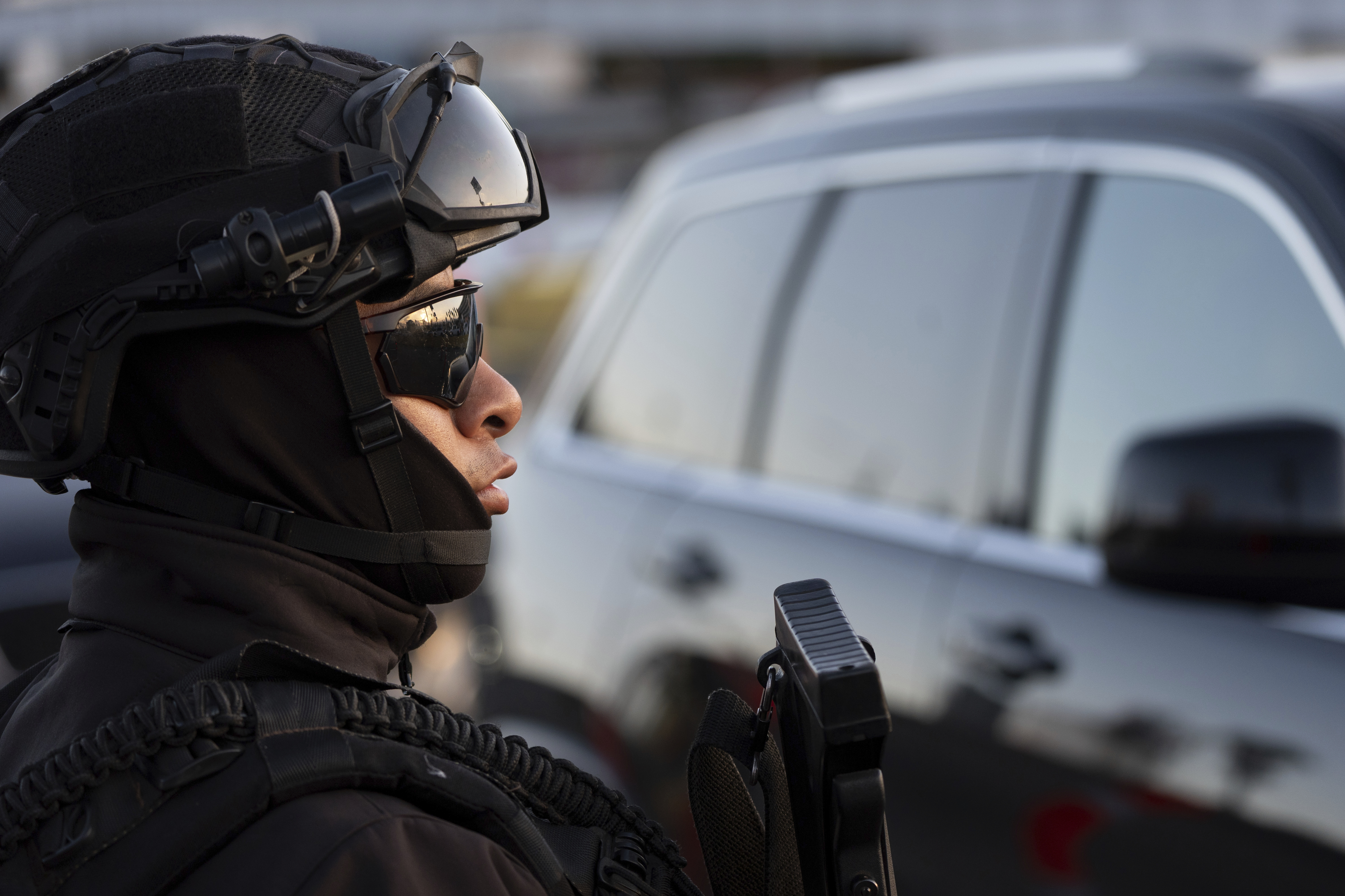 A member of Mexican National Guard in front of a car at the US-Mexico border