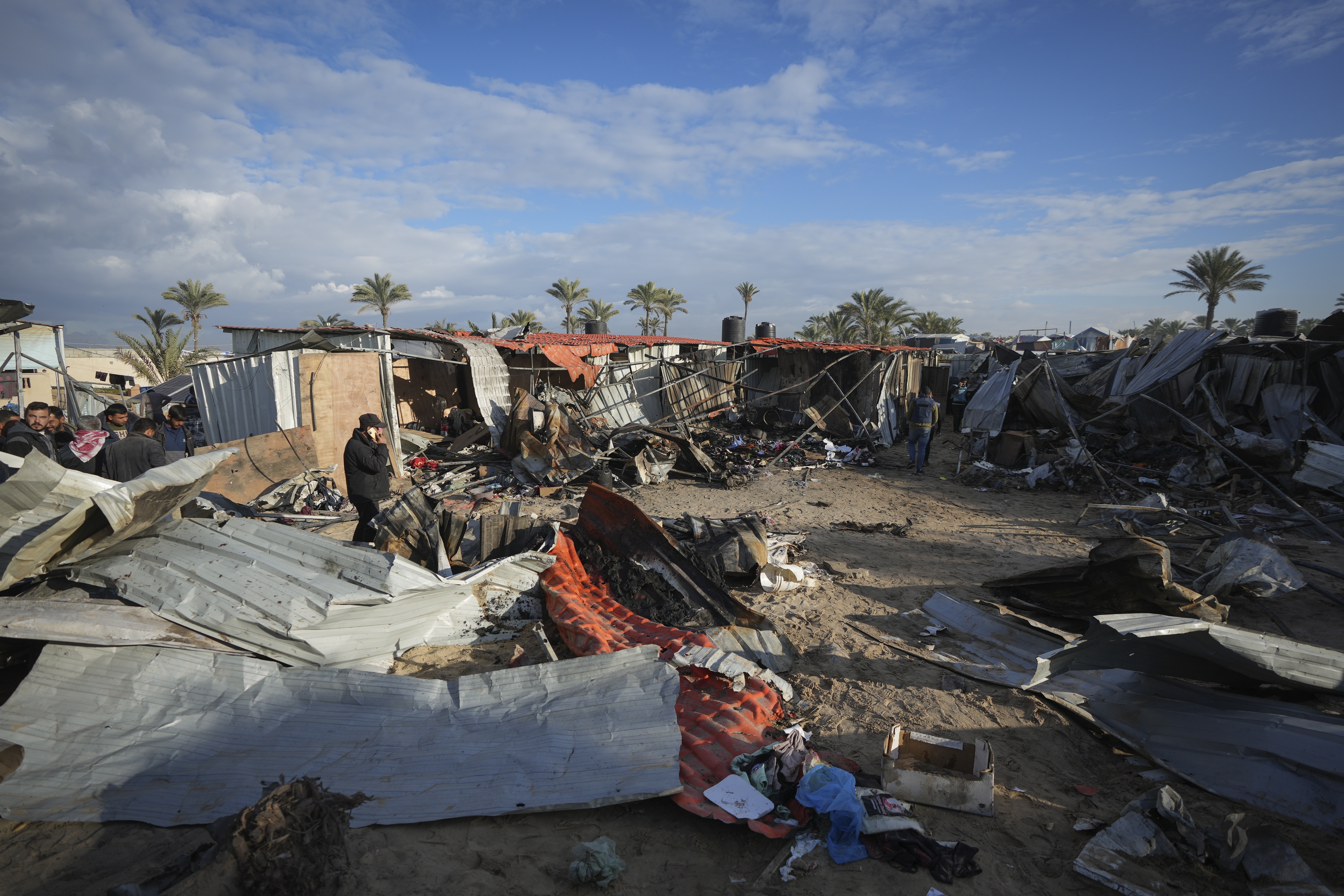 A doll lies among plastic debris and clothes in the aftermath of an Israeli airstrike