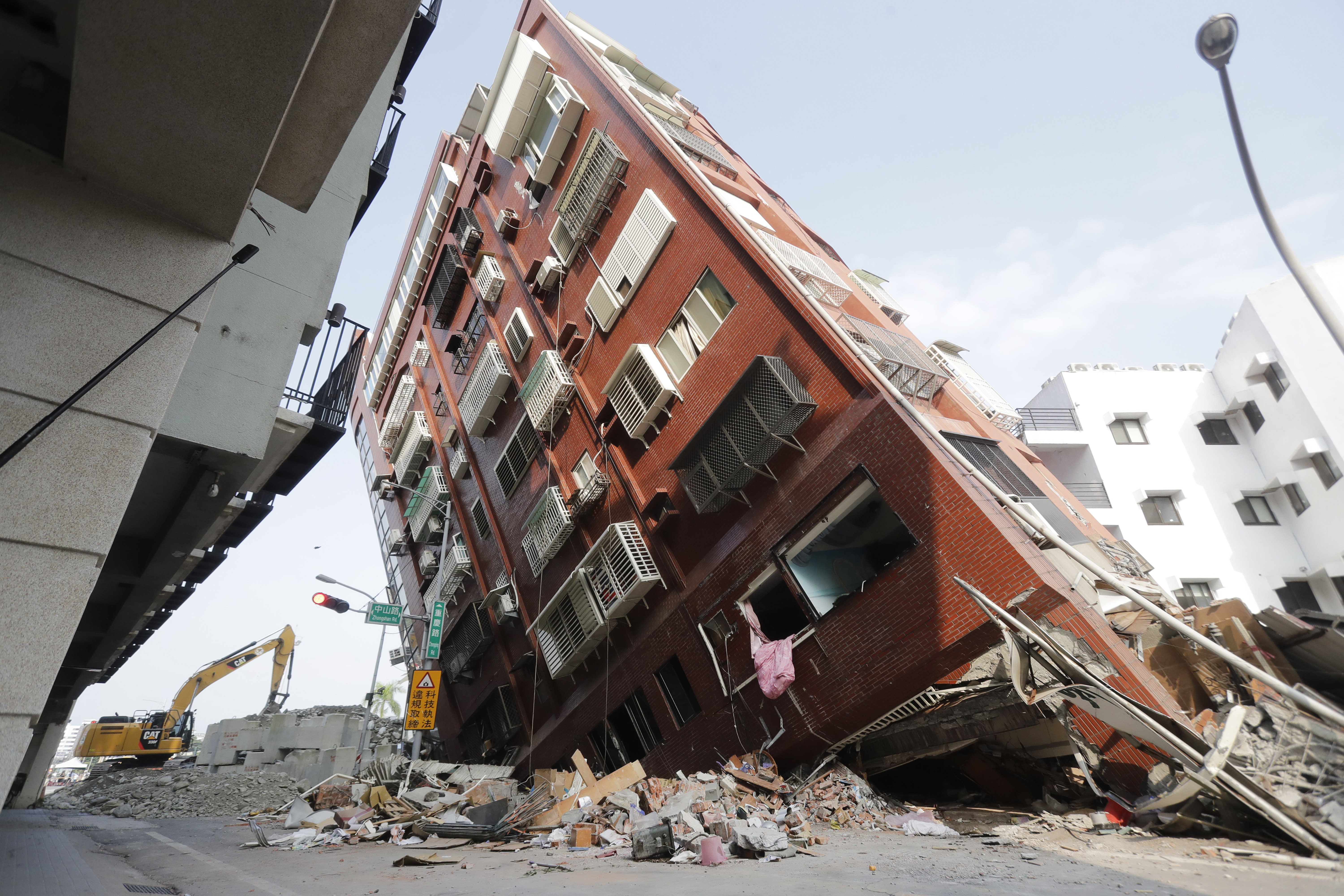 Debris surrounds a titled building a day after a powerful earthquake struck, in Hualien City, eastern Taiwan, April 4