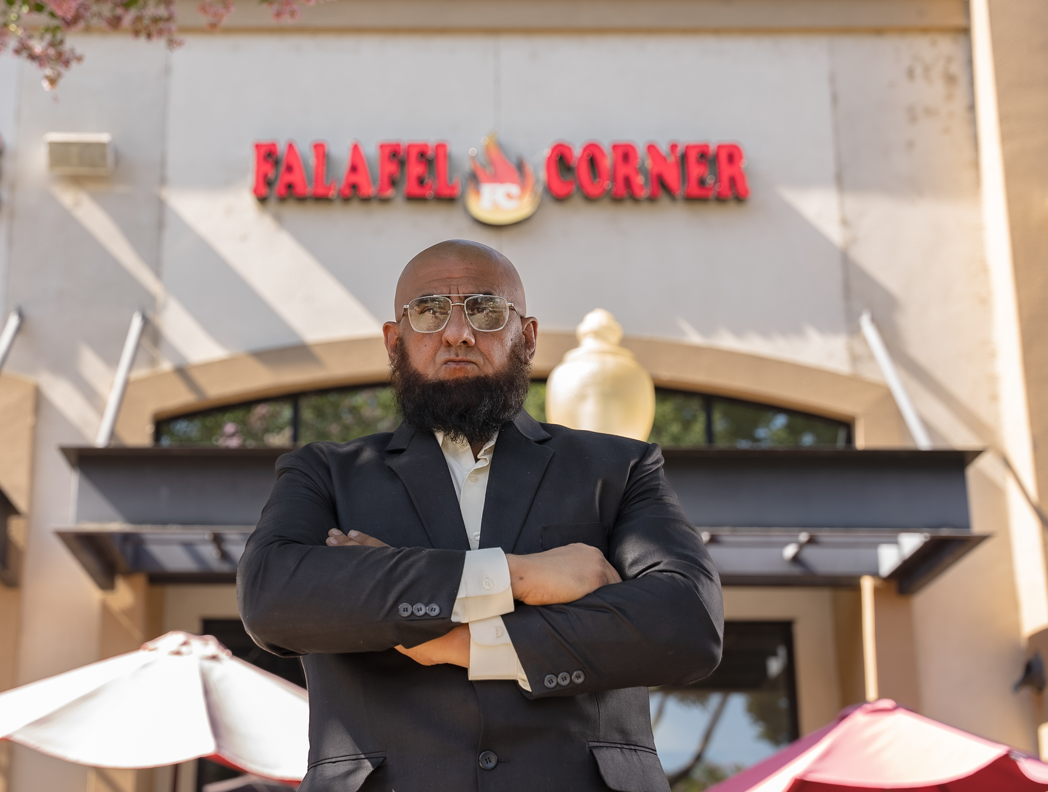 Sajad Shakoor in front of the Falafel Corner restaurant