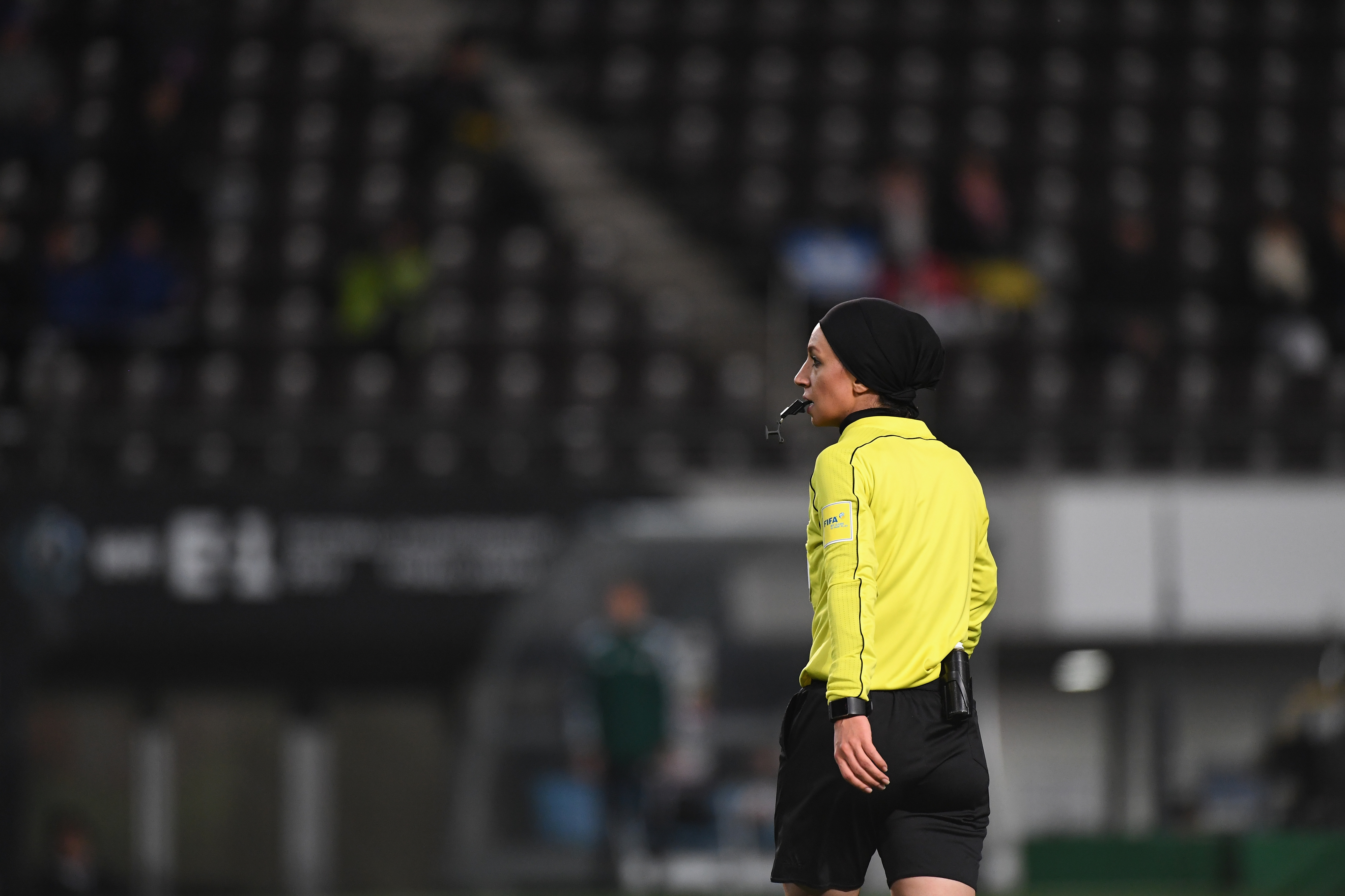 Mahsa Ghorbani working as a football referee.