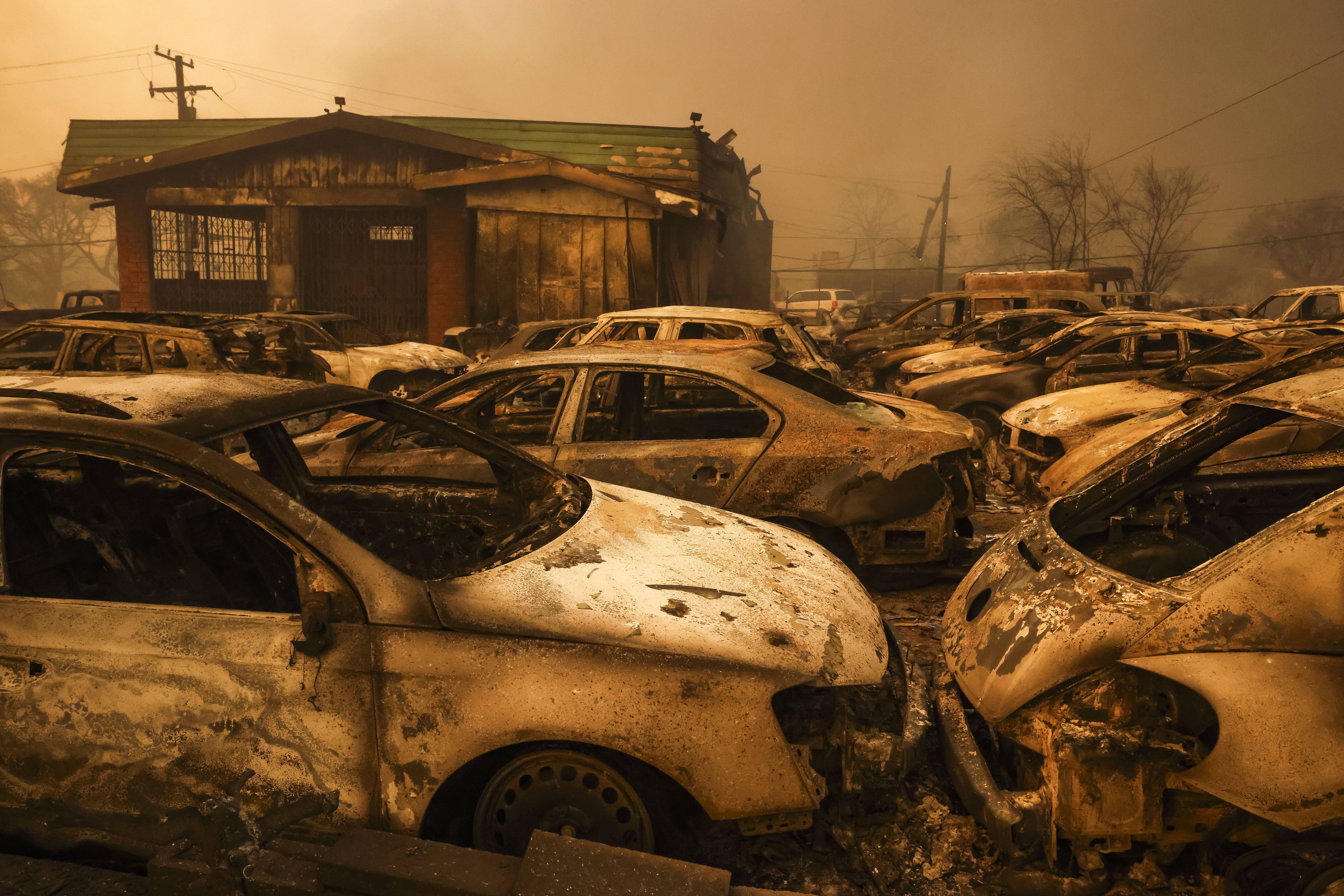Burned cars in a lot destroyed by the Eaton wildfire in Altadena, California, USA, 08 January